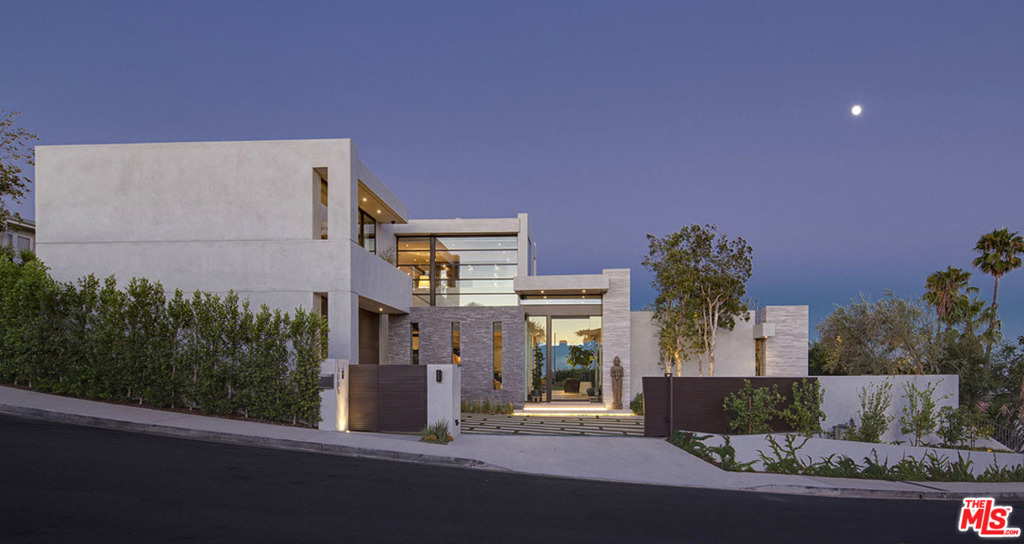 This one-of-a kind new construction is bathed in natural light & overlooking captivating city, canyon & partial ocean views. Custom built w/no expense spared & only the finest materials & high end finishes, this 5 bed, 7 bath property offers over 6,200 sf of luxury living. Walled for privacy, the motor court leads to a towering glass entry. Once inside, the open floor plan has floor-to-ceiling pocket doors that create the ultimate indoor/outdoor experience. Living rm features f/p, wet bar & wood paneled ceilings. The vast great rm is designed for large scale entertaining. State of the art kit is equipped w/built-in banquet, center island, sleek Neolith countertops & Bauformat cabinets. A floating wood staircase leads to the 2nd level, which includes a family rm & rooftop deck. Master suite w/wrap around balcony facing panoramic views. A sep gym & office lead to the inviting outdoor space w/infinity pool & spa, covered living rm, sports court, Zen garden, sitting area & grassy yard.