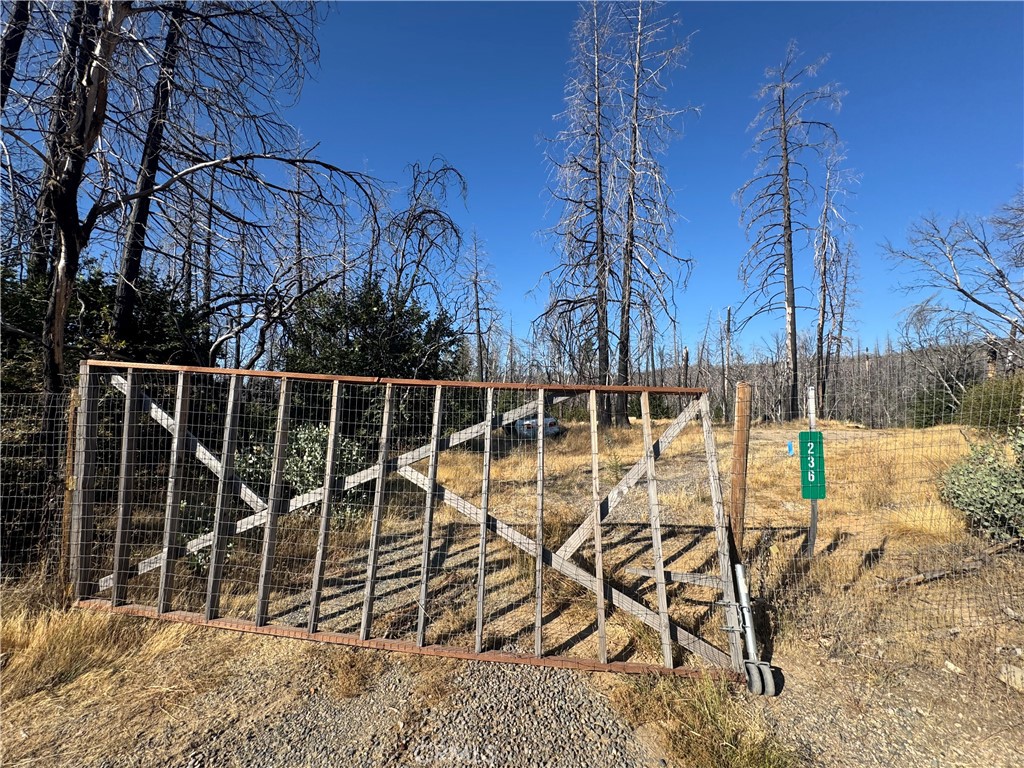 Discover the potential of this 4.16-acre property. The property features a private well, existing power, and a natural year round spring, a valuable and unique water source. Septic system is in place, though condition after the fire is unknown.