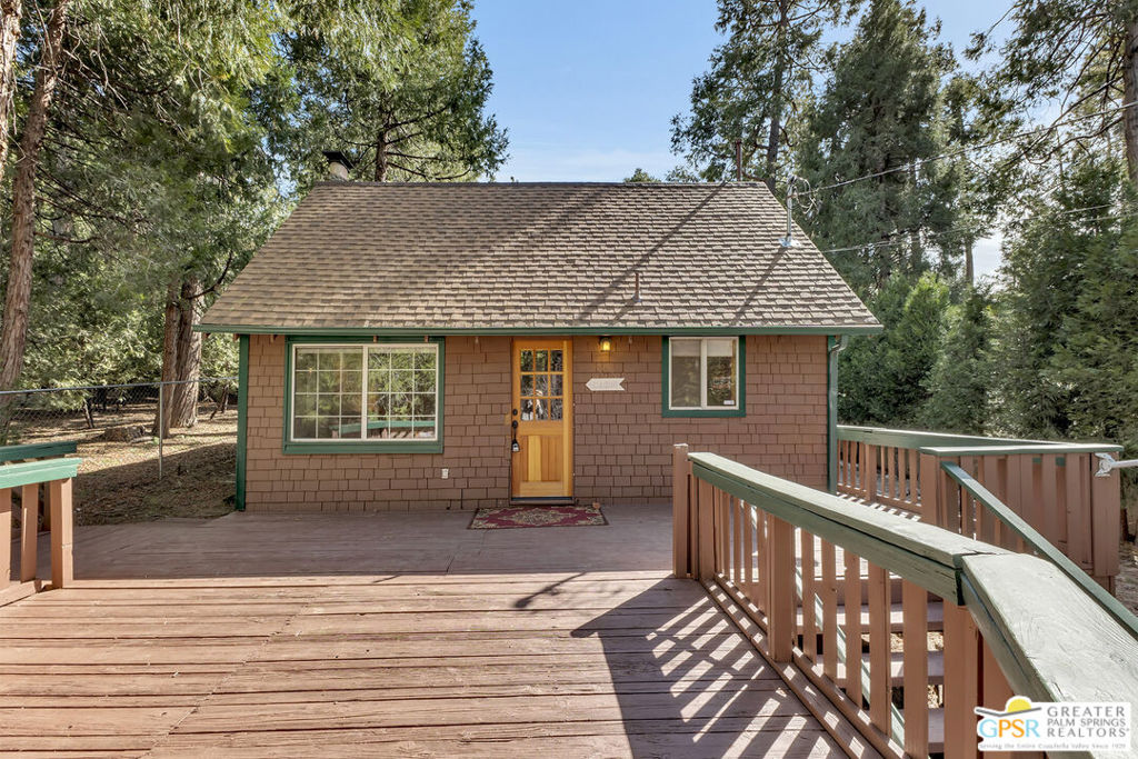 This adorable 1941 cabin blends vintage charm with modern updates, making it a comfortable and inviting mountain home. Sitting on a fully fenced .16-acre lot, it offers 2 bedrooms, 2 lofts, and 3 bathrooms, plus an additional upstairs space with a closet that could be used as a small sleeping area or extra storage.Downstairs, the living room features a wood-burning stove, and a utility room provides washer and dryer hookups. A guest bath is easily accessible, and the primary bedroom includes its own ensuite bathroom.Upstairs, two lofts offer additional private spaces. A small hallway leads to a private bedroom with an adjacent bath, along with another small sleeping nook that works well for kids or extra guests.Recent upgrades include a new roof, septic tank, water heater, and upgraded electrical panel. Paid-off solar panels were installed in 2021, and the owners haven't had an electric bill in three years. Fresh paint, quartz countertops, updated bathroom vanities, and newer flooring give the home a refreshed look.Priced to sell, this charming cabin offers a great mix of character and modern convenience, plus easy access to town.