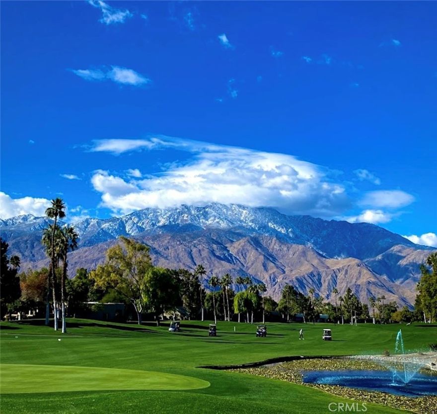 END UNIT..... ON THE VERY TRANQUIL  (PGA) "7 LAGO GOLF" COURSE WITH VIEWS FROM THE LIVING ROOM AND PATIO OF THE PRISTINE GRASSY KNOLL AND DIMINUTIVE LAKE WITH A SERENE SPRAYING WATER FOUNTAIN AWAY FROM THE BUSY TRAFFIC, A MOUNTAIN VIEW FROM THE FRONT DOOR FACING WEST AS WELL AS A SHORT WALK AWAY FROM THE SWIMMING POOLS. Soothing Southwest architecture exterior with mere clusters of 4 units to enjoy minimum congestion. There are 675 VERY EXCLUSIVE FREESTANDING VILLAS within the resort that enhances the values and draws golf celebrities  to stay and often own in Desert Princess. Of course, a 27 hole golf course enables you to likely have immediate access to the greens, featuring 85 bunkers and 21 lakes. Aquatic activities? 35 well maintained swimming pools conveniently located for immediate access, no matter where you deside to swim. 9 tennis courts, additional activities such as basketball courts, bocce ball courts, horseshoes, pickle ball courts and indoor fitness area, 24/7 professionally manned friendly security entry. Guests from Canada and our very own Great Lakes-Northeastern brethren stay the winter months to trade from the snow to our beloved California sunshine. Shopping? Rancho Mirage and Palm Springs, Art Museums, The famous Tram are less than 10 minutes drive away fron Desert Princess Resort.