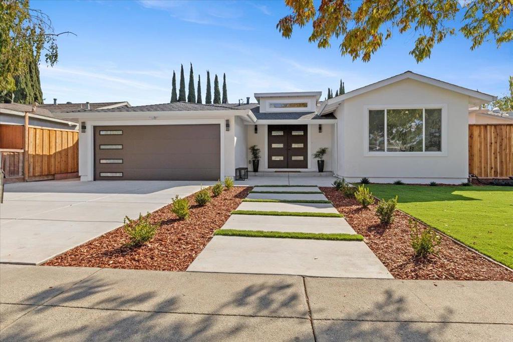 Reimagined in 2025 this Evergreen single-story 4-bedroom, 4-bath luxury residence offers over 2,000 sq. ft. Nearly 93% new construction of refined living space on a low-maintenance lot, delivering modern elegance at every turn. Step inside to soaring ceilings, abundant natural light from 6 skylights, and oak flooring throughout, setting the stage for a sophisticated lifestyle with ensuite bedrooms and your choice of inside or outside laundry. The chef's kitchen is a true centerpiece, featuring a dramatic stone waterfall island, custom cabinetry with abundant storage, premium appliances, a built-in coffee bar, and a cooler crafted for entertainers and culinary enthusiasts alike. The primary suite includes a walk-in wardrobe, indulgent en-suite bath, and serene views of your fig tree and future garden oasis. Designer bathrooms showcase quartz vanities, LED mirrors, and glass-enclosed showers. Flexible laundry options allow for a stackable washer/dryer inside the home or in the epoxied garage. Every detail is newroof, electrical, plumbing, windows, insulation, manicured landscaping with auto irrigation. Additional highlights include an epoxy-finished 2-car garage with EV charging, tankless water heater, and central A/C.