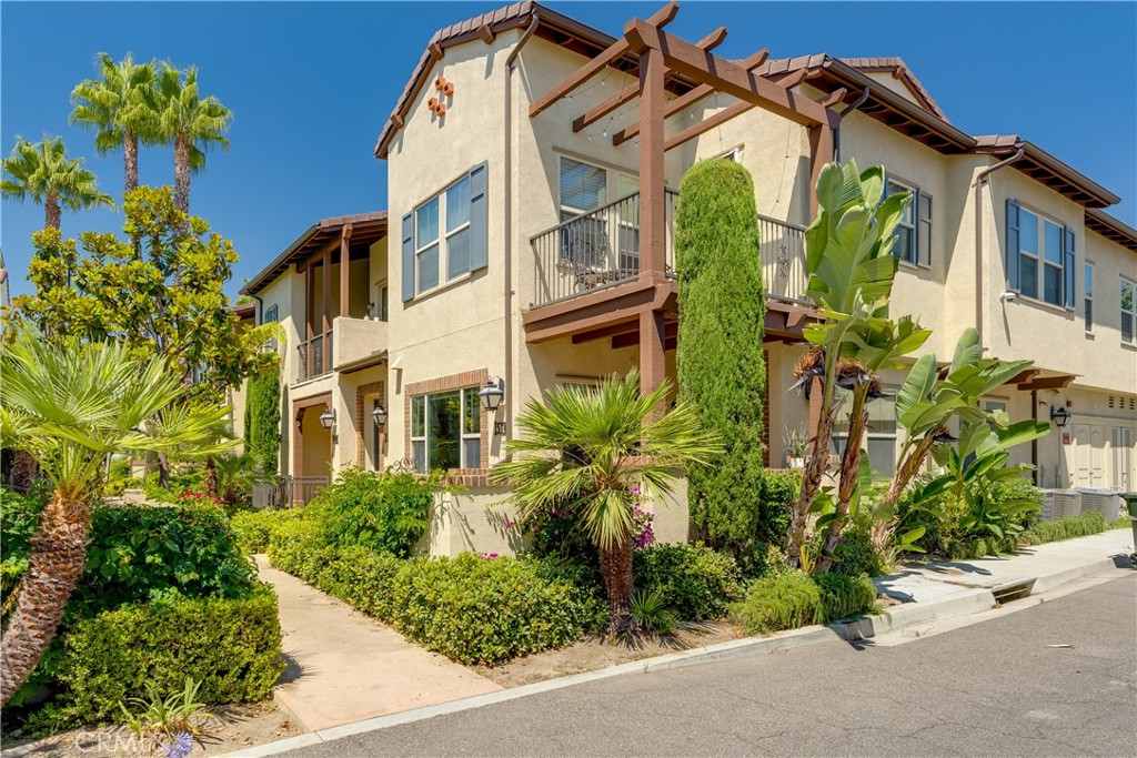 Stop the car!! Your condominium is waiting for you. This modern condominium is located on the first floor and is a stunning one bedroom, one-and-a-half-bathroom condo with indoor laundry and an attached garage. As you walk up to this condominium, you will notice the lush landscaping and your spacious covered patio perfect for relaxation. Upon entering the home, you are greeted by an open floor plan ideal for entertaining. Soothing grey and white color tones flow throughout the home. Once inside, you will notice a quint area for a dining table. Proceed past the dining room area and you have a nice size kitchen with a large island countertop with room for seating. The modern kitchen is spacious with plenty of cabinet space. Passing the kitchen, you will enter your living room which will accommodate your cozy couch and flat screen TV. Proceed down the hallway and you arrive at your guest half bathroom. Continuing down the hallway and on your left is the large primary bathroom and at the end of the hall is your convenient indoor laundry room and attached garage door entry. Saving the best for last is the primary bedroom. This primary bedroom offers more than ample space for your furniture and a great night's rest. The amenities are second to none. The Colony Community offers 3 saltwater pools, two jacuzzies, one gym, a clubhouse, a cabana which can be rented out for special occasions, grassy areas, dog park and free shuttle rides around the neighborhood. This home is close to Disneyland, Angels Stadium and the Packing House. This wont last long.