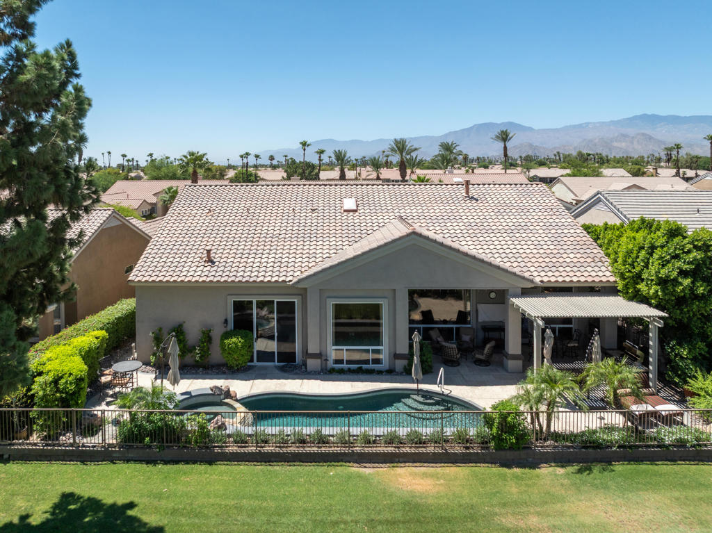 Welcome to this STUNNING and RARE 3,146 sq. ft. TUSCANY model conveniently located near the Sunset View Clubhouse, sitting over the 18th fairway. Great panoramic views, from Mt. San Gorgonio to the Shadow Mountains, clubhouse, green, and lake. The north facing back of this home features a salt water pool & spa, multiple seating areas--great for entertaining, a newer misting system, newer bar-b-q, flatscreen TV, and other well-appointed features. There have been numerous upgrades to the luxurious interior of this home with its 12-ft ceilings, several windows, natural light, and over 2000 sq. ft. of gorgeous porcelain tile flooring. The spacious family room has an amazing fireplace and crown moldings with custom built-ins. The formal living room and dining room also have crown moldings and window shutters. The Chef's kitchen has granite counters, new Samsung appliances, double oven and custom cabinets with underlighting. This kitchen is bright and spacious! Wonderful primary suite has a corner fireplace and a HUGE closet, with an entrance to the rear yard as well. Primary bathroom has oversize tub and stall shower, dual sinks, with marble surfaces. The opposite side of this home features 2 guest suites, with one being used as an office with closet. The other large guest suite has a private entrance to the backyard. All bathrooms feature marble surfaces. Laundry area is spacious with many cabinets and a sink. The garage is 2+ golf cart, with storage cabinets, mini-split A/C, and new garage door motor. This home is truly, as the builder called it, a ''grand estate'' model, impeccably maintained.