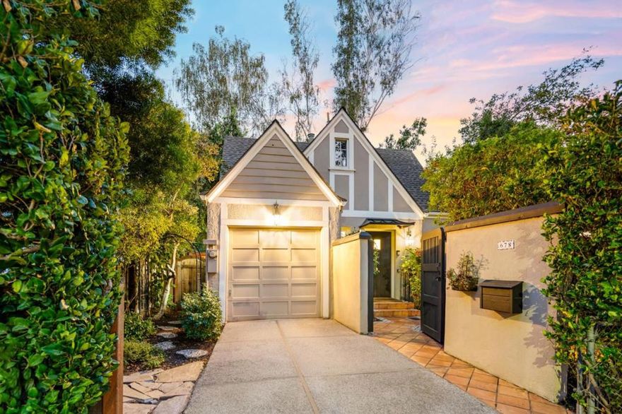 With 1,100 sq. ft. of living space, this English Tudor style cottage near downtown Palo Alto is a jewel box home blending European heritage with California sophistication. Inspired by the Tudor grace that once influenced Walt Disneys castle, it evokes storybook beauty with modern comfort and craftsmanship. Walk up to a manicured courtyard framed by hydrangeas and greenery, a serene retreat for afternoon tea or quiet gatherings. Inside, traditional architectural details including picture rail moldings, decorative millwork, marble accents, and hardwood floors highlight timeless craftsmanship. This home offers an exceptional alternative to condominium living with the privacy of a standalone residence. The living room features a classic fireplace with a new mechanism and new lightings, while the kitchen showcases marble counters, custom cabinetry, and a reupholstered banquette. 2 bathrooms echo the homes elegance with marble finishes and upgraded fixtures. 3 bedrooms include a spacious primary and a jewel box secondary with built ins. Recent updates such as fresh paint, new sewer lateral, and full termite tenting ensure peace of mind. Steps from University Avenue, Stanford, and top rated schools, this home captures the rare elegance of a mini mansion in the heart of Palo Alto.