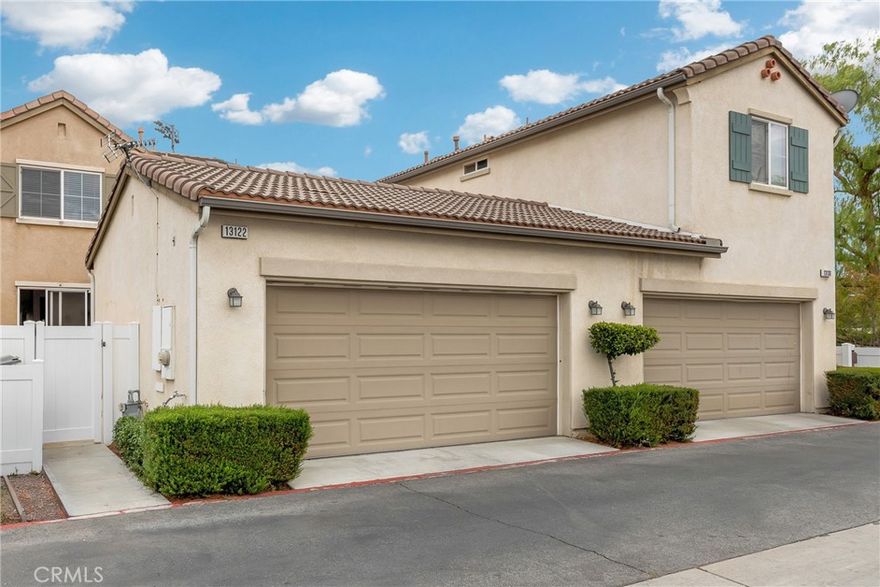 Rare opportunity to own a detached home in the sought-after Towngate community, directly facing Towngate Memorial Park. This freestanding residence offers the privacy of a single-family home with the convenience of low-maintenance condo living—no shared walls except on detached garages. With approximately 1,646 sq. ft., this 3-bedroom, 2.5-bath home features a bright, open layout with high ceilings and great natural light. The inviting living room with fireplace flows into the dining area and a comfortable family room adjacent to the kitchen, creating an easy, open connection throughout the main level. Upstairs, the primary suite is spacious with a large walk-in closet and ensuite bath. Two additional bedrooms share a full bath, perfect for family, guests, or a home office. Enjoy your private outdoor space with minimal upkeep and an attached two-car garage for added convenience. The home is ideally located just two blocks from Moreno Valley Mall, restaurants, and shopping, with quick access to local schools and freeways. Homes in this community rarely come available, especially with a park-facing location. This one is move-in ready and priced to sell.