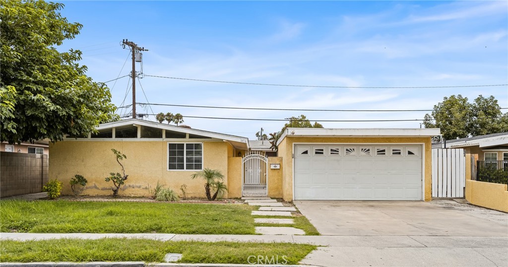 Welcome to 1414 Frances Drive, a charming single-family residence nestled in the heart of Anaheim. Built in 1955, this well-maintained home offers 4 spacious bedrooms and 2 full bathrooms, ideal for families or those seeking extra space. The classic mid-century design features original character combined with modern comforts. The property includes a 2-car garage, providing ample parking and storage. Step outside to a generous backyard—an inviting space for outdoor gatherings, gardening, or relaxing in the California sun. Located in a quiet, established neighborhood, the home is conveniently situated near parks, schools, shopping centers, and major freeways, offering both tranquility and accessibility.