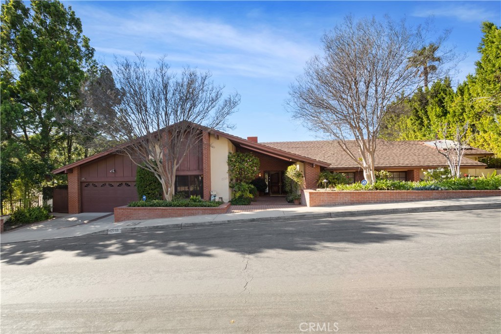 VIEWS, VIEWS, VIEWS... Very charming private 4+5 single story pool home with panoramic mountain & city light views in top rated Lanai school district. Updated chef's kitchen with large L shape granite top center Island, double Viking oven, 6 burner Viking cooktop and sitting area with mountain views. Wood floor and rec3ssed lighting throughout. 3 bedrooms on one side and one bedroom on the other side perfect for guests or in-laws. Master suite with 180-degree views and ample closet space opening to backyard overlooking the mountain and city light views. Master bathroom with spa tub, double sink, and gym. Attached two car garage. Backyard with newly updated pool, spa & mountain views. two separate viewing deck perfect for afternoon coffee or wine while enjoying the serenity and the views. Washer dryer included. Minutes from Mulholland and some of the best rated private schools. Easy access to Westside. Do not miss this beautiful view home in Encino Hills