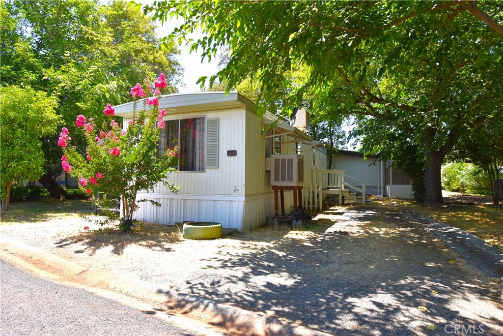 Welcome to the Lake Vista Senior Community where this nicely priced 1-Bedroom, 1-Bathroom home awaits. This home is located in a quiet neighborhood toward the front of the park on a through street for convenient access. The yard has mature shade trees to allow you to enjoy the outside even on the hot summer days. This home also features laundry hookups inside the enclosed patio area and a storage shed for all of your belongings. The park features a community pool, laundry room and a picnic area with tables, barbeques, and a nice lawn area. Come check out this home in this very nice senior little community.
