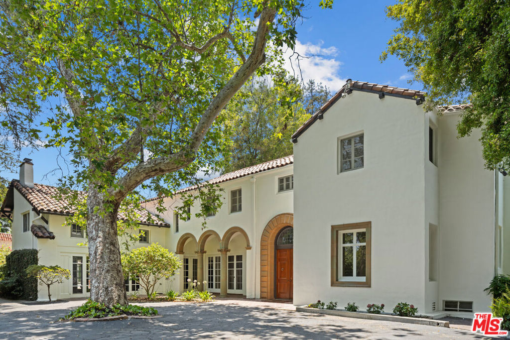 With a legacy spanning more than a century, Woodacres Estate holds a rare place among Santa Monica's most treasured locations. Nestled among majestic pine trees and lush gardens, this remarkable property offers a peaceful sanctuary on over an acre of land. A gated entrance at the end of a private cul-de-sac provides privacy while keeping you close to the shop and restaurants on Montana Ave & San Vicente Blvd as well as the beach! Originally designed in 1921 by renowned architect John Parkinson, the Italian Renaissancestyle villa showcases timeless elegance. The main residence offers more than 4,700 square feet of living space with five bedrooms and three-and-a-half baths. Beautifully landscaped grounds create a seamless blend of charm and function. Beyond the home, mature trees frame a serene pool and yard, offering a setting that is truly breathtaking. A must see!