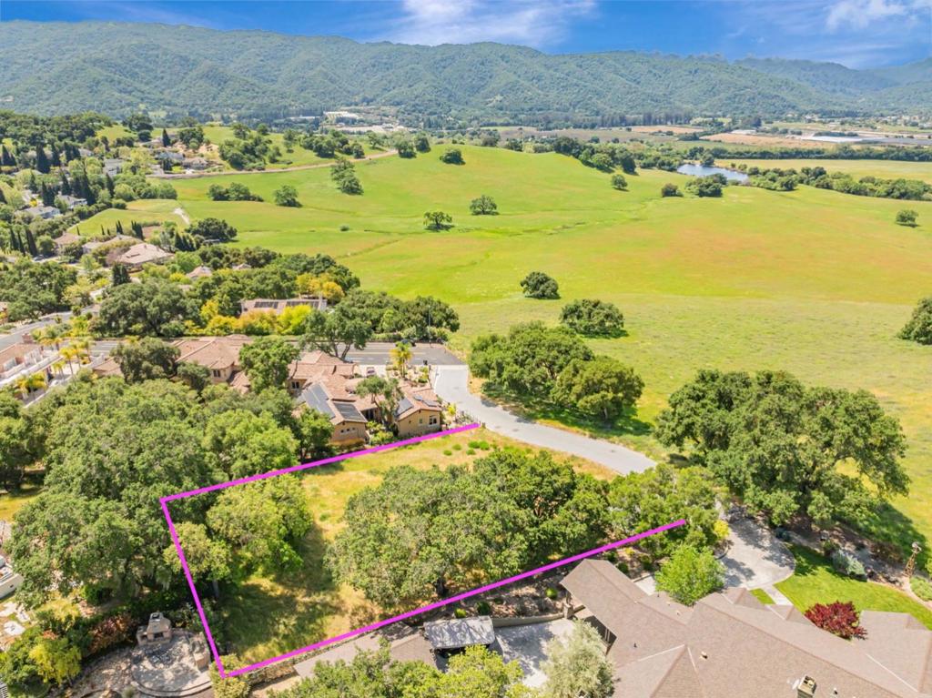 Perfectly situated on a hilltop in Country Estates overlooking gorgeous Day Valley, this 30,000+sf residential lot offers unparalleled views with the Santa Cruz Mountains as its backdrop. The lot is ready for you to plan your dream home or use the plans available designed specifically for this property. This super private lot places you at the crossroads of rural charm and urban accessibility. Enjoy its proximity to local farms, wineries, trails, golf, Gilroy Gardens, and a quick drive over the hill to the beach. Don't miss this rare chance to own a prime lot ready to transform your dreams into reality!