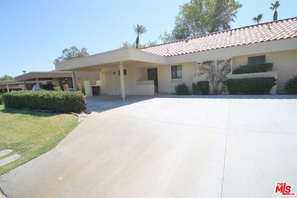 Olympic Model -2BR/1.5 BA, Den, 938 sq. ft. This is a newly remodeled unit you will love the open design of the kitchen and you will feel right at home in the Tommy Bahama style furnished condo. This home is East facing for plenty of a.m. sunshine. Great view of the 13th fairway. "Olympic" Model floor plan with upgrades! KITCHEN: Bar seating for 4 Stainless steel appliances Electric Cooktop Microwave Coffee maker LIVING AREA: Ceiling fan 42" Flat panel TV w/cable Frontier Cable TV + Free Long Distance to US + Canada! High Speed Wireless Internet MASTER SUITE: King Size Bed 39" Flat panel TV w/cable Large closet Private Bath GUEST SUITE: Queen Size Bed TV Ceiling fan Private 1/2 bath PATIO: Large extended patio East facing Overlooking the greenbelt Near sparkling pool & spa BBQ Carport