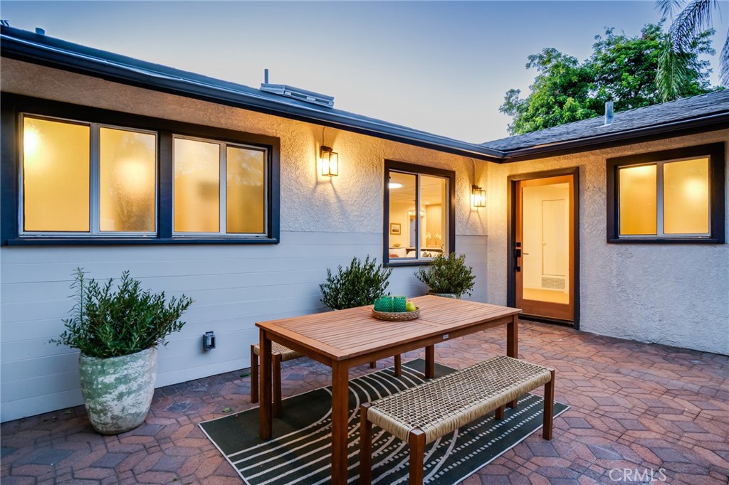 Bright and Beautiful! This custom-crafted 4-bedroom, 2-bath cutie is situated in one of NW Pasadena's most charming pockets and leaves no detail spared. Designed by Helmut W. of Archwood Design Haus, this joy filled home has had every inch of it reimagined with thoughtful and intentional details integrated into every space from the custom skylights down to the handcrafted wine rack and abundance of storage, everything has been carefully curated to create a truly magical space. Warm earthy finishes blend effortlessly with endless custom details and meticulous craftsmanship. In addition to a breathtaking interior, this home offers a tremendous amount of lovely and very usable outdoor space. As you enter the large gated driveway past the spacious 2 car attached garage, you'll find a totally private, expansive front courtyard that offers a perfect opportunity for outdoor family gatherings and dining al fresco. Inside, good energy exudes throughout while warm wood floors span the entirety of an open-concept living room with custom built-in floor to ceiling shelving. All is overlooked by a gorgeous kitchen with oversized island, custom-built cabinetry galore, and all new high-end appliances. The dreamy primary retreat is perfectly situated in its own quarters and is a true sanctuary featuring romantic lighting and wallpaper details with a stunning ensuite bath! Large folding doors open seamlessly from the living room and lead to a lush and spacious backyard, complete with a covered patio, vibrant green lawn, and an additional storage shed. The surrounding neighborhood is absolutely wonderful and offers close proximity to beautiful parks, hiking trails and nearby old town Pasadena.