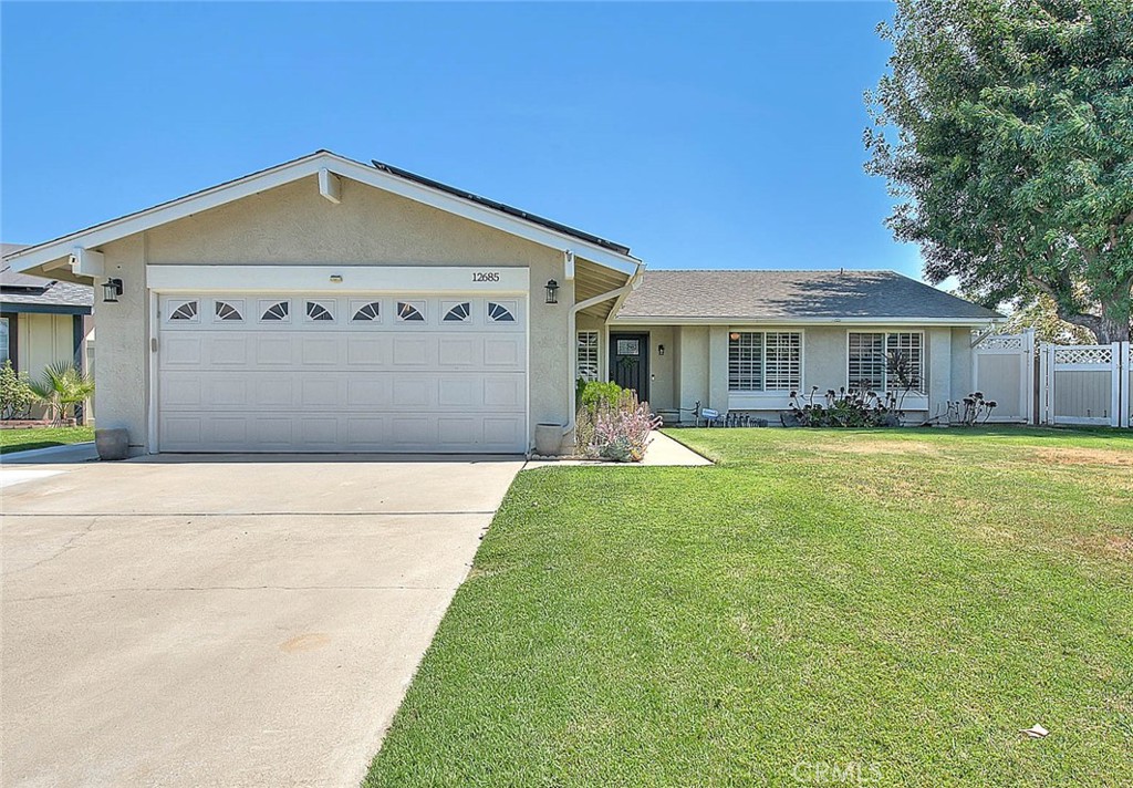 Welcome to 12685 Birch Ave in the heart of Chino – a beautifully updated single-story home that blends modern upgrades with comfort and charm. Step inside and you’ll immediately notice the open floorplan, thoughtfully designed to create seamless flow between the living spaces. With 3 bedrooms, 2 bathrooms, and a versatile flex room that can serve as a 4th bedroom or office, this home adapts to your family’s needs with ease. The custom remodeled kitchen is truly the centerpiece, featuring stainless steel appliances, granite countertops, a farmhouse sink, a large center island, and custom cabinetry. Designed for entertaining, the kitchen opens directly to the spacious family room where one of the home’s two fireplaces adds warmth and character. Throughout the home, you’ll find beautiful flooring, plantation shutters, custom baseboards, and tastefully remodeled bathrooms—every detail has been thoughtfully chosen. Step outside and you’ll discover a backyard built for both relaxation and entertaining. The professionally designed hardscape, large grass area, and vinyl fencing create a clean and inviting space. Host unforgettable gatherings under the Aluma Wood patio cover or the backyard gazebo with electrical outlets, perfect for outdoor dining or a quiet evening retreat. The highlight is the sparkling rock pool and spa, making the backyard an entertainer’s dream. Additional features include direct access to the two-car garage, dual fireplaces, and a location that is centrally situated near schools, shopping, and dining. This is more than just a house—it’s a place to call home. With its thoughtful upgrades, open design, and backyard oasis, 12685 Birch Ave is ready for its next chapter.