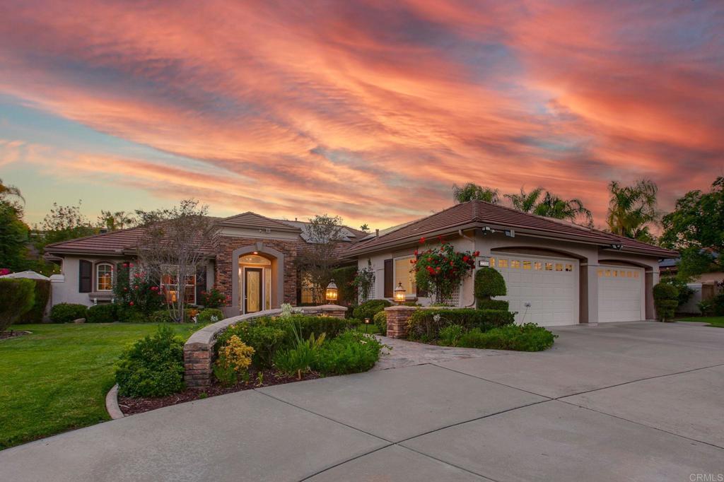 Experience unparalleled luxury in this exquisite single-story estate, a private oasis nestled within the exclusive Rancho Verde Estates. Welcome to your personal resort. Custom-tiled, formal foyer with a dramatic rotunda welcomes you. Soaring 10-foot ceilings and extensive crown moldings set the tone for this masterfully designed residence. The seamless flow of this single-story home with no Mello-Roos or HOA fees offers unparalleled convenience and accessibility. The formal living room, adorned with a marble fireplace and bespoke mantel, boasts stereo speakers, recessed art lighting, and custom built-in cabinetry. At the heart of the home, the gourmet center island kitchen features a show-stopping waterfall island with newly installed marble countertops. An adjacent butler's pantry, is complete with a Sub-Zero wine fridge and elegant glass cabinets. The family room, wired for surround sound, offers a marble fireplace and a built-in entertainment center, creating a calming space for relaxation. Discover an entertainer's paradise designed for the ultimate resort experience. The magnificent backyard boasts a sparkling, heated pool and spa, complemented by a serene waterfall and a tranquil koi pond. Gather with friends and family in the incredible outdoor gourmet gazebo kitchen. This fantastic covered area, complete with stainless steel appliances and a Dacor grill, is perfect for lively al fresco dining and making lasting memories. An inviting outdoor fireplace provides the perfect ambiance for gatherings and unforgettable evenings under the stars. Cultivate your passion in the beautiful, fenced-in garden adorned with mature fruit trees. For the golf enthusiast, a private golf area featuring a sand trap, chipping range, and putting green offers endless enjoyment. This exceptional residence also features a dedicated bonus office with a full wall of custom cherry wood cabinets, a four-car garage with built in storage, and advanced systems including an OWNED solar system, high-efficiency appliances and dual-zone heating and air. The primary bedroom, a sanctuary of comfort, includes a built-in entertainment center, linen cabinets and a serene sitting area with bay windows. The luxurious primary bath boasts a double vanity with stunning marble countertops. All bedrooms have ensuite bathrooms. More than just a home .