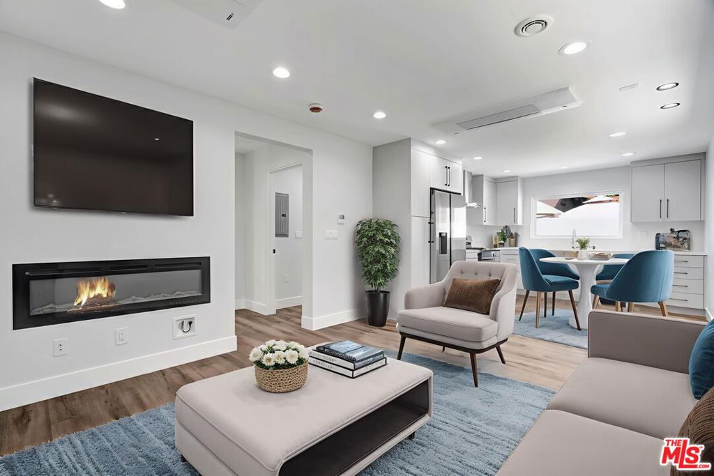 Absolutely stunning and spacious 1br/1ba unit in a small 5 unit complex. Newly built, well appointed, and spacious unit features a massive great room, ample modern cabinets and new stainless steel refrigerator, stove, and dishwasher, Oversized undermount sink, modern multi unit central AC and heat and modern decorative and functional fireplace unit. Floating vanity in the bathroom. Washer/dryer included. The unit is modern, spacious and well located close to freeways, shopping and convenient to all areas of the City. Upstairs you will find three spacious bedrooms each stunning in size, getting brilliant natural light. The bedroom has cathedral ceilings and the bathroom is sleek, modern and spacious with rain head showers and contemporary tile work. Hardwood floors throughout. Be the first to live in this meticulously finished, modern home. Welcome! Your new home awaits. All occupants over 18 must complete an application. One year lease to begin. Tenants pay all utilities except water. Available for immediate move in.