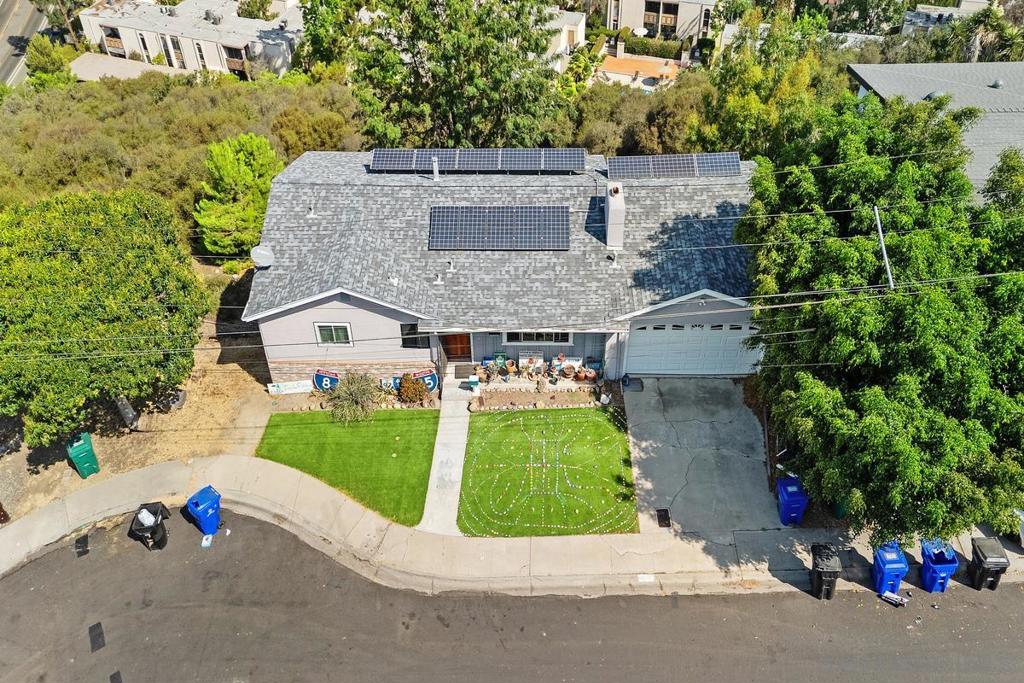 Perched on a quiet cul-de-sac in the highly coveted El Cerrito neighborhood with sweeping canyon and neighborhood views, this 3bd/2ba home offers 1,840 square feet of potential. The spacious floor plan includes multiple living areas, a fireplace, and abundant natural light from large windows framing tree-top and hillside scenery. The kitchen and baths are ready for your updates, making this an ideal opportunity to customize and add value. Additional highlights include owned solar, a two-car garage, and a private deck overlooking the canyon, perfect for morning coffee or evening sunsets. This home is ideal for buyers seeking a project with incredible upside in a central location close to freeways, shopping, and dining.