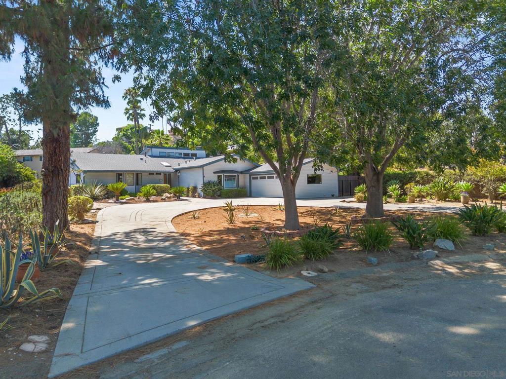 Stunning home RARELY AVAILABLE with luxury, private guest house! Welcome to this peaceful and private retreat tucked away at the end of a cul-de-sac in the highly sought-after Mt. Helix area within the prestigious Helix Knolls Estates. Surrounded by lush, mature landscaping, this exceptional property offers the perfect blend of elegance, comfort, and versatility. Step inside to soaring vaulted ceilings and rich wood flooring that create a warm, inviting atmosphere and is truly an entertainer's dream. The heart of the home is a chef’s kitchen featuring premium Bosch appliances, custom cabinetry, and generous workspace, designed to inspire culinary creativity. A standout feature of this property is the attached luxury guest house, thoughtfully designed with a full kitchen, private bathroom, and separate entrance. This high-end unit also includes its own designated parking and private outdoor space, offering ideal privacy and independence for extended family, guests, or renters. Whether used for multi-generational living, a private guest house, or instant rental income, this thoughtfully planned space adds incredible value to the home. Whether you're sipping your morning coffee on the patio, or enjoying a quiet evening by the fire, this home offers the ultimate Southern California indoor-outdoor lifestyle. This is more than just a home — it’s a rare opportunity to own a versatile, upscale property in one of La Mesa’s most desirable neighborhoods.