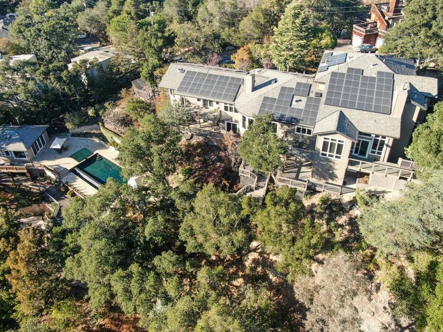 Exceptional 6 bedroom, 7 bath custom designed residence and pool house perfectly positioned on just under an acre in tranquil Emerald Hills. This 5700-+ square foot home includes 2 master suites on the ground level, 3 more bedrooms upstairs, and one bedroom on the lower level. In addition to the pool house, there is a full in-law suite with a private entrance. This thoughtfully laid-out floor plan welcomes guests into a private entry courtyard with lush landscaping and pathways. The kitchen is designed in a highly sought-after modern European style that includes: a 6 burner Thermador range with grill and steam oven, hidden espresso bar, double dishwashers, pantry cabinets, and a large island. From the terraces, the views span out to the surrounding hillside and the resort-like infinity-edge swimming pool area. Fully loaded poolhouse. also includes 2 large driveways, 3 car garage, 3 Tesla walls, Big Solar System, 13 surveillance cameras. Minutes to 280, walk to Edgewood Park trail. More