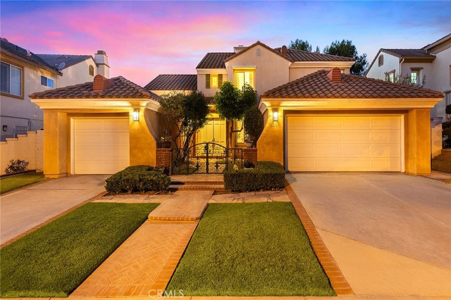 Welcome to a breathtaking masterpiece of luxury living in the prestigious 24-hour guard-gated community of Ridgemoor. Nestled in the heart of Rowland Heights, this fully upgraded & elegantly designed 4-bedroom, 4-bath residence combines timeless sophistication with modern innovation.

The main-floor guest suite offers comfort & flexibility for guests or multigenerational living, while the large bonus room can easily serve as an office, playroom, or fifth bedroom. Step inside to discover soaring high ceilings & an open-concept floor plan that radiates grandeur & warmth. The spacious living & formal dining areas flow seamlessly into a newly remodeled gourmet kitchen, featuring marble countertops, cabinetry, premium finishes, & high-end stainless-steel appliances. A huge center island & built-in wine fridge reflect the home’s commitment to luxury & function. The cozy family room, enhanced by Hunter Douglas window coverings with a designer's fireplace, opens directly to the modern, sleek, stylish kitchen, creating the perfect gathering space for family and friends. Upstairs, you’ll find three additional spacious bedrooms, including a luxurious primary suite showcasing breathtaking panoramic and sunset views. The newly upgraded master bathroom features a soaking tub, separate glass shower, dual modern vanities, and a customized walk-in closet. Two additional bedrooms share a beautifully upgraded bathroom with double sinks. Enjoy panoramic city lights and sunset views from both the primary suite and the backyard, creating a serene, resort-like atmosphere. Step outside to your private backyard retreat—an entertainer’s dream—featuring a state-of-the-art motorized louvered pergola that adjusts sunlight and shade at the touch of a button. This smart outdoor living system elevates both comfort and year-round enjoyment. Double-pane windows with wood shutters & customized window coverings.  Recessed lights & wood floor throughout the entire house. Additional highlights include a three-car garage, with the third garage that could be used as a storage or a workshop, and a private front courtyard that enhances both privacy and security.

Located in one of Rowland Heights’ most coveted neighborhoods, this residence offers the perfect combination of security, prestige, and modern elegance, just minutes from top-rated schools, fine dining, shopping, and easy access to the 60, 10, and 57 freeways.

Experience refined luxury living—welcome home to 18551 Amberly Place.