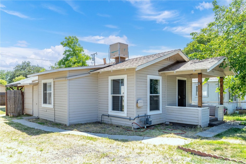 This charming 2-bedroom, 1-bath home offers style and function in a compact 722-square-foot layout. Thoughtfully updated, the home features laminate flooring throughout, a sleek, modern bathroom with a tiled shower, and an open kitchen with freshly painted cabinets. New interior paint adds a clean, refreshed feel, while mini splits and ceiling fans provide year-round comfort. The property also includes a detached shop with indoor laundry, a large fully fenced yard, and a welcoming front porch. With a newer roof and tasteful updates throughout, this well-maintained home is move-in ready and full of charm.