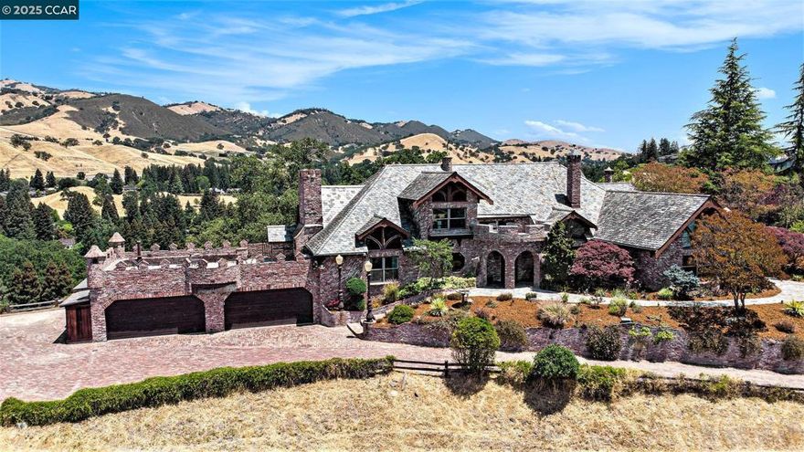The Castle of Alamo, perched in the foothills of Mt. Diablo, this estate is a rare architectural gem designed for those who appreciate distinction, privacy, and craftsmanship. Evoking the timeless romance of an old-world European manor, this custom-built home blends fairy-tale design with modern amenities, offering a one-of-a-kind living experience just minutes from downtown Alamo and award winning schools. Set on over 2.22 acres of secluded grounds, the home features approximately 4,476 square feet of interior living space with 4 bedrooms, 3 bathrooms, and a series of bonus lofts and flexible living areas that bring charm and function to every corner.  As featured in Forbes Magazine, the home's stone exterior, and slate roof immediately set it apart. Inside, soaring ceilings, dramatic staircases, and hand-crafted details create a sense of grandeur. The chef’s kitchen is well-equipped with a Viking gas cooktop, double ovens, a center island, and a cozy breakfast nook with garden views. The spacious primary suite and main living areas are located on the entry level for effortless living, while the loft(s) above adds opportunity for a home office, studio, or private retreat.   This is your chance to own what is arguably the most unique property in the entire Bay Area!