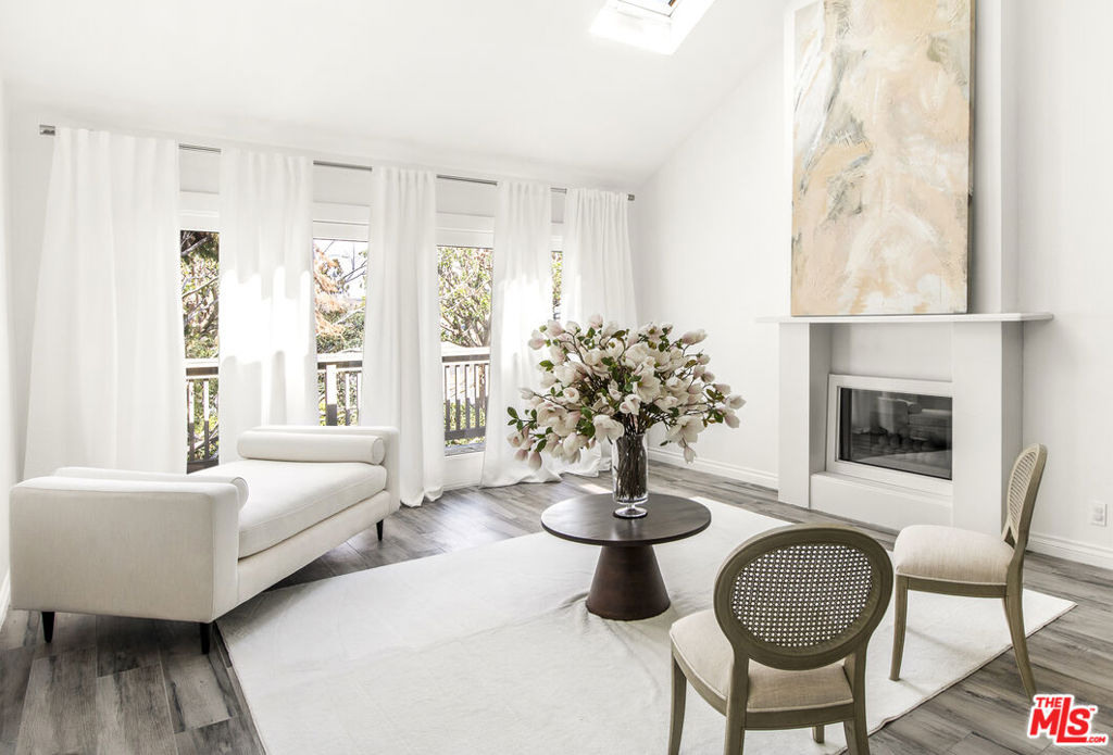 Indulge in love at first sight with this contemporary haven in Newport Beach! Instantly captivate your heart upon entry this is the one! Impeccably updated with designer flair, relish vaulted ceilings, motorized skylights, and French Doors leading to a private lanai. A striking stone fireplace sets the scene while new wood-like porcelain tile sweeps you through. Discover 2 expansive bedrooms, 2 full baths, and in-unit laundry. The sleek kitchen boasts a farmhouse sink, stainless steel appliances, and modern lines now featuring a brand-new integrated Bosch dishwasher with a custom panel. Plus, with a secure entrance, parking, pool, spa, and tennis court, the Sea Island community offers an enviable lifestyle. Adjacent to the esteemed Big Canyon Country Club and a leisurely stroll to Fashion Island. And don't overlook the added benefits of a new roof and skylight. Elegant living without the typical Newport Beach price tag awaits at 38 Sea Island!