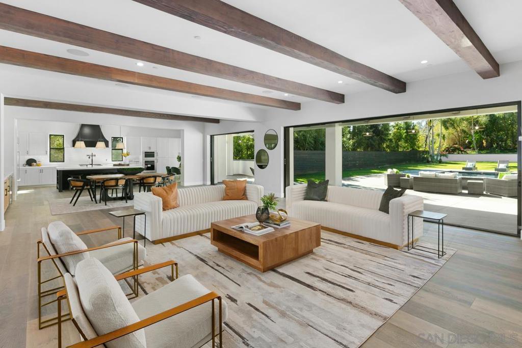 Exquisite residence in La Jolla with a sophisticated design that enhances its timeless essence and ideal open layout. This spectacular light filled home spreads across on a flat large lot surrounded by lush green views. Splendor permeates throughout every detail of this astonishing home, it has 6 spacious beds and 7.5 baths, accompanied by a modern cabana equipped with BBQ, 3 TVs and private bathroom connected to the grandiose pool, spa and entertainment area. High ceilings and windows surrounding the property allow for uniform lighting throughout with refined engineering hardwood floors. This open layout promotes gatherings due to its multiple rooms such as its top of the line open kitchen with high-end stainless steel appliances connected to the elegant living & dining room which look out onto the extensive garden and outdoor pool area. This versatile floor plan allows for a quintessential indoor-outdoor lifestyle. Situated on an extensive lot with a large driveway, providing plenty of room for parking. This residence is the perfect blend of chic and comfort, with all the resources you need to feel right at home. It’s prime location provides easy access to all the best that La Jolla has to offer.