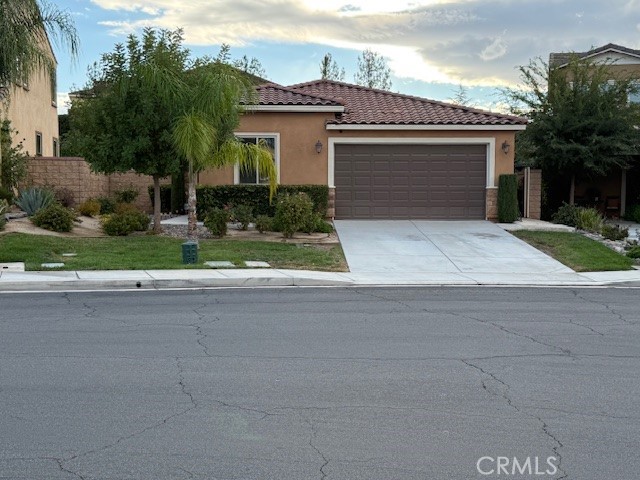 Welcome to beautiful Canyon Hills!! This single story home features three spacious bedrooms and a den. Tile flooring flows throughout the entry, kitchen and bathroom areas, while the living room and bedrooms offer cozy carpeting. This home is designed for modern living with a tankless water heater, eat-in-kitchen and outdoor patio. The large open kitchen connects to the living room, creating an ideal space for entertainment. It features an island with seating, a microwave conveniently positioned above the stove, and stunning granite countertops. The deep stainless-steel sink is both functional and elegant. A generous walk-in pantry provides ample storage space. Large sliding glass doors lead out to the backyard, flooding the home with natural light. The the large primary bedroom and attached bathroom is a relaxing retreat, featuring a large walk-in closet, a separate shower, and a soaking tub. Two additional bedrooms are supported by a hall bathroom with a tub/shower and double sinks. Step outside to enjoy the backyard, equipped with a covered patio area perfect for gatherings. The Canyon Hills community is packed with resort-style perks: three sparkling pools, two spas, a park with a splash pad, courts for basketball, tennis and pickleball, scenic trails, playgrounds, dog parks, and picnic spots. Tenant screening on RentSpree.