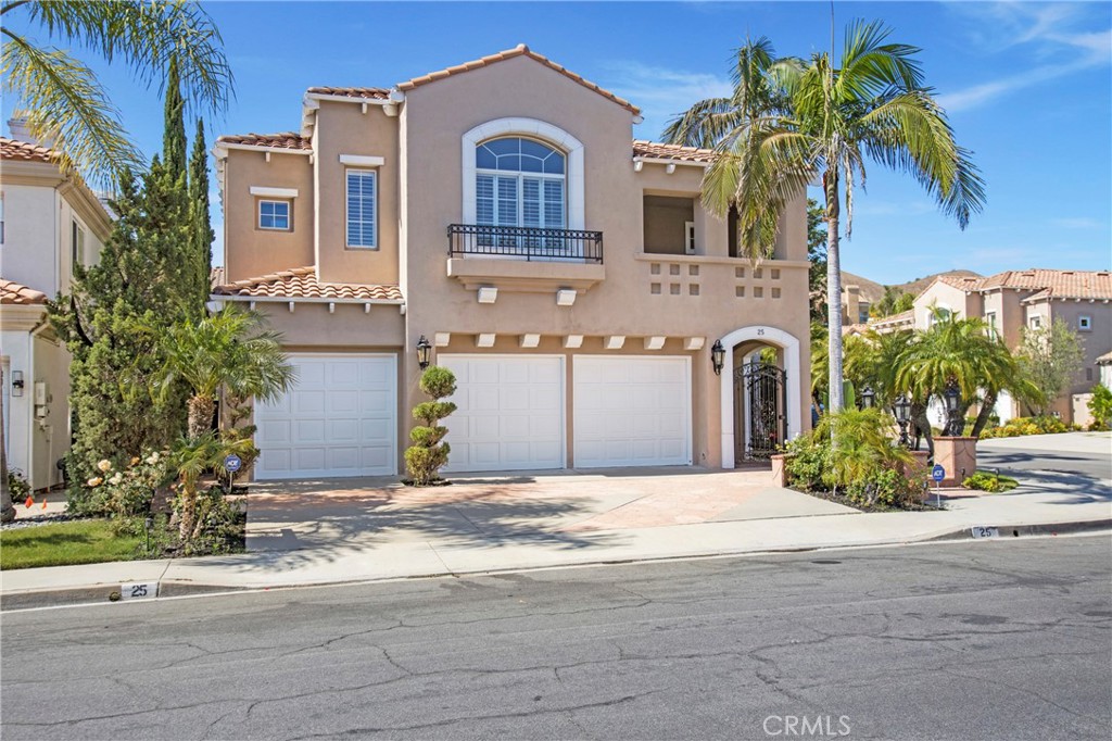 DISCOVER UNPARALLELED LUXURY at ROXFORD CREST in FOOTHILL RANCH — showcasing the community’s most coveted model, this residence stands as the ultimate statement of sophisticated, upscale living. Situated on a prime inside corner lot, this exquisitely designed residence offers 3,607 square feet, enhanced by over $250,000 in premium upgrades. The home includes four en-suite bedrooms, a generous bonus room with a private balcony, 4.5 baths, and 3 elegant fireplaces.The mature landscaping enhances the property’s curb appeal, guiding visitors toward an elegant iron gated entry that opens to 25 ft soaring ceilings and a sweeping wrought-iron spiral staircase. The formal living room features a custom 15-foot mirror and an elegant stone fireplace, which flows seamlessly into the formal dining area where french doors provide direct access to the patio area. The Gourmet Kitchen has a stone topped island, new double oven, stainless cooktop, and opens to an adjacent in-kitchen dining area and spacious family room with built ins and a cozy fireplace. Step outside to your private oasis, thoughtfully designed for seamless indoor-outdoor dining and entertaining. Enjoy relaxing by the glistening pool, spa, and waterfall, all beautifully framed with a mature landscaping. Guests will love the private downstairs in-law suite with an en-suite bath and private side entrance for added convenience. The expansive Primary Suite has a private retreat with a double-sided fireplace and vaulted ceilings. Indulge in the spa-like bath, with his and her dual vanities, a generous soaking tub, sleek frameless shower, and an impressive walk-in closet. Located opposite the master are two additional bedrooms, each with their own en-suite bath, and a generous BONUS ROOM with a private balcony- perfect for use as a fifth bedroom or home office. Additional features of the property include marble flooring throughout, custom window treatments, copper re-pipe, new designer carpeting, fresh interior paint, new pool equipment and recessed lighting. Outdoor enthusiasts will love hiking and biking in Whiting Ranch Wilderness Park that surrounds the community. Neighborhood amenities include a pool, spa, clubhouse, sports courts, tennis facilities, several parks, and playgrounds. ideally located near Foothill Ranch Blue Ribbon School, library, Irvine Spectrum, local dining/shopping, and toll road access. It’s a community that offers the perfect setting to create lasting memories. Hurry this won't last!