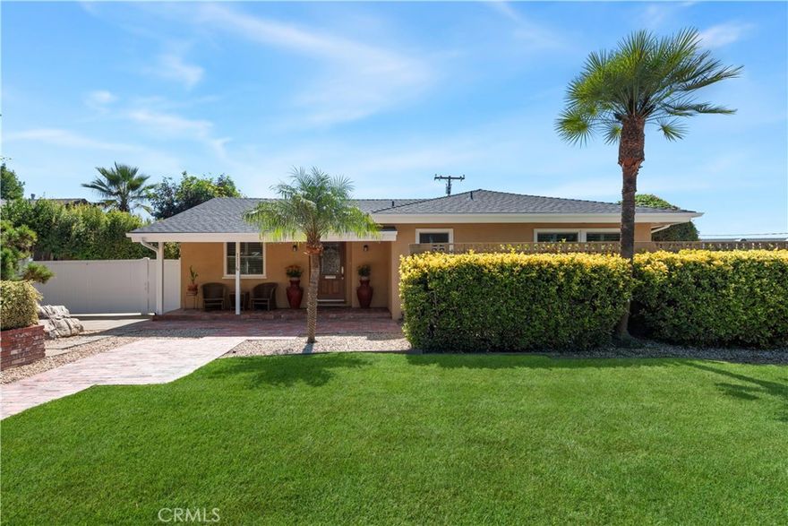 Welcome to this stunning residence in the highly sought-after Floral Park neighborhood of Santa Ana!  Step inside and experience timeless appeal with modern convenience. This beautifully maintained home features original hardwood floors, a spacious open floor plan, and fresh interior paint. The inviting living and dining are enhanced by skylights that fill the space with natural light and a cozy fireplace that adds warmth and elegance. The family room offers a comfortable setting for gatherings, complete with built-in bookcases that add character and functionality. The kitchen, showcasing elegant Caesarstone countertops, premium appliances, slate flooring, and abundant wood cabinetry. The home’s layout provides privacy and comfort, featuring well-appointed bedrooms with window shutters, a Jack-and-Jill bathroom, and a second full bath with bathtub. A convenient laundry area adds practicality to daily living. Additional highlights include central air conditioning for year-round comfort. Step outside to enjoy the best of Southern California living — a low-maintenance backyard with pavers and a sparkling swimming pool, perfect for relaxing or entertaining. The long driveway offers ample parking and leads to a detached two-car garage. Nestled in the heart of Floral Park, one of Santa Ana’s most beautiful and historic neighborhoods, this home is surrounded by tree-lined streets, classic architecture, and a strong sense of community. Enjoy nearby parks, charming cafes, and local events that make this community one of the most desirable places to live.