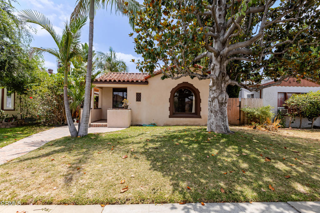 Discover the perfect blend of classic charm and modern convenience in this beautifully crafted Spanish-style residence. Featuring warm wood floors, graceful arched doorways, and a traditional Spanish tile roof, the home exudes timeless character at every turn. Inside, bright and inviting interiors are enhanced by recessed lighting throughout, while the thoughtfully designed kitchen stands out with a sleek gas range and a charming Dutch door that opens to a private side yard--ideal for seamless indoor-outdoor living.This home is as efficient as it is elegant, equipped with a solar power system that keeps energy costs down. Additional highlights include a detached garage and the convenience of an EV charging plug-in located right on the street. Whether you're entertaining guests or enjoying a quiet moment at home, this residence effortlessly combines vintage appeal with modern-day functionality.