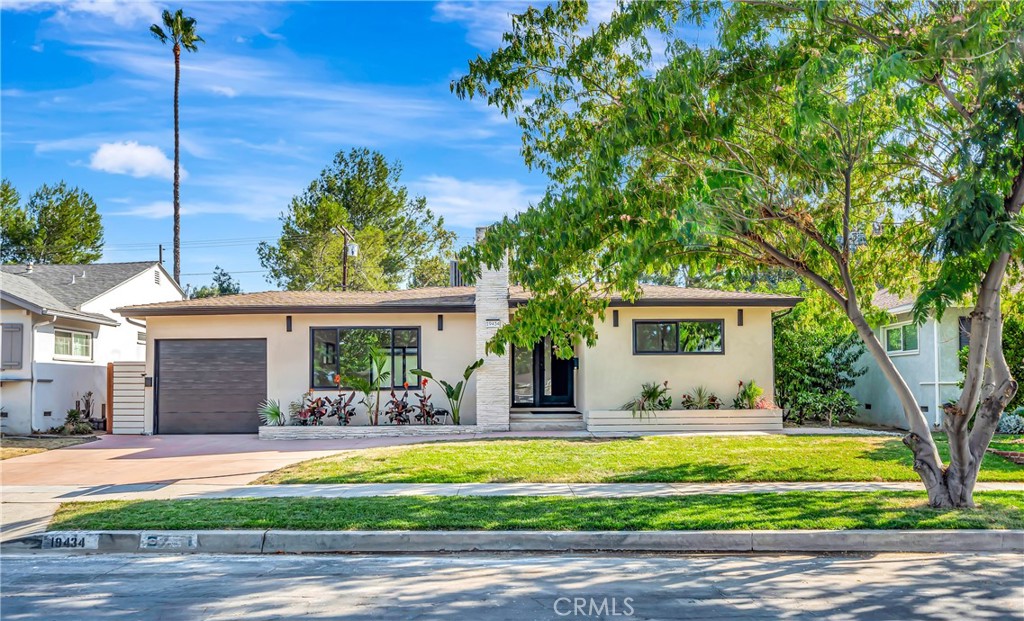 Discover this stunning Tarzana property, offering a beautifully remodeled main house at 19434 Calvert (approx. 1,500 sq. ft.) and a fully permitted ADU at 19432 Calvert (approx. 400 sq. ft.)—together creating nearly 1,900 sq. ft. of refined living space. Designed with an open-concept floor plan, this residence blends style and functionality, creating an inviting atmosphere ideal for both everyday comfort and sophisticated entertaining. Step inside to find brand-new floors, recessed lighting, and fresh interior & exterior paint that elevate every corner of the home. The gourmet chef’s kitchen is a showstopper, featuring stainless steel appliances, quartz countertops, and a breakfast bar perfect for casual dining or hosting friends. A separate laundry room off the kitchen adds convenience to your daily routine.
The spacious living room, anchored by a cozy fireplace, opens through French doors to a lush grassy backyard with a sparkling oversized pool—an entertainer’s dream. The primary suite is a private retreat, offering a walk-in closet and a spa-inspired bathroom with an oversized shower, LED lighting, and a large vanity. Two additional bedrooms and a large, well-appointed bathroom provide comfort and flexibility for family or guests.
The detached ADU, with its own private entrance, is ideal for rental income, multi-generational living, or as a pool house. Every detail is new, including the tankless water heater, A/C system, and numerous upgrades. All this, just moments from The Village, premier shopping, dining, freeways, houses of worship, and top-rated schools. Turnkey and move-in ready—welcome home! Photos are virtually staged.