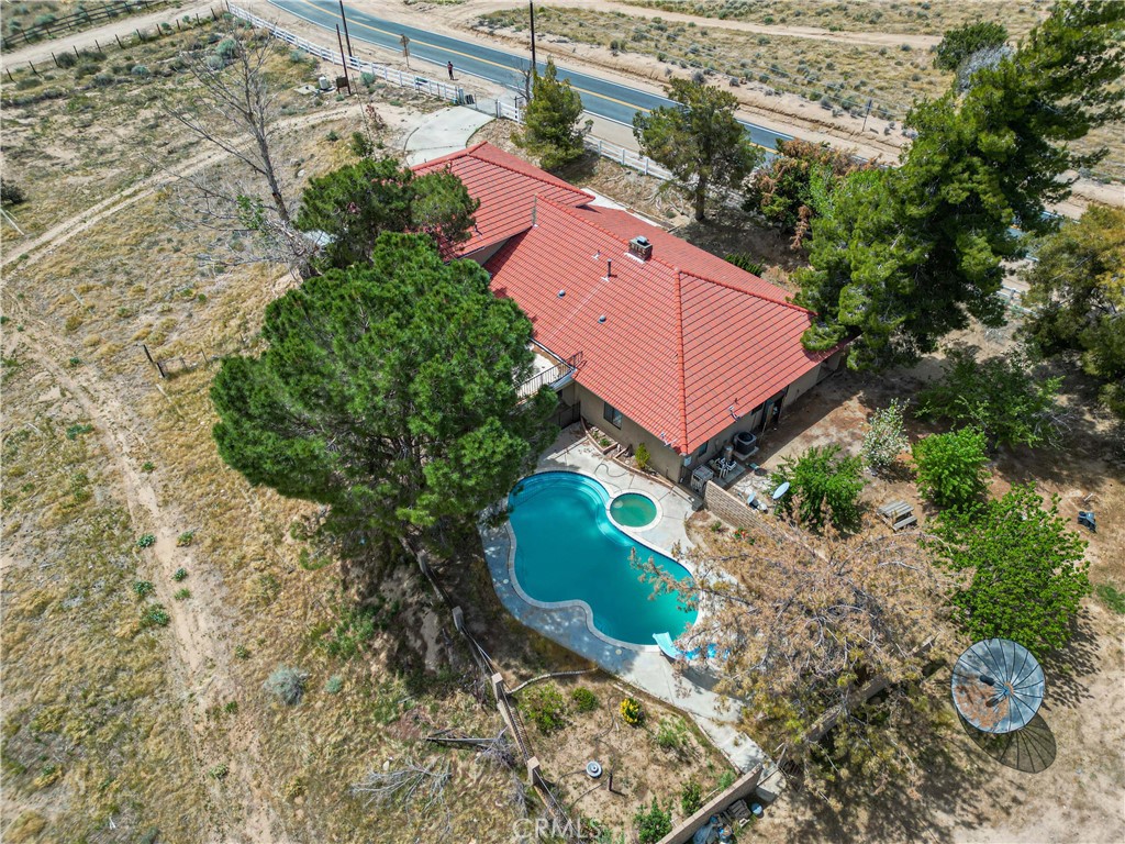 WOW!!!! Welcome to Your Dream ranch – Two Homes • Massive 4,000 Sq Ft Metal Shop • Private Well on 6.1 Acres!
This is the multi-use ranch you've been waiting for—featuring two separate homes, a huge 4,000 sq ft metal shop, and a private well, all set on 6.1 acres of flat, usable land near the Mojave River. Zoned RL-5 Agricultural Preserve, this one-of-a-kind property offers the ideal setup for multi-generational living, income potential, agriculture, recreation, or a home-based business.
Main Residence:
• 2,682 sq ft, 3 bedrooms, 2 bathrooms
• Expansive formal living room with cozy fireplace
• Spacious family room perfect for gatherings
• Formal dining area and open kitchen with bar seating—ideal for entertaining
• Upstairs primary suite with private balcony and scenic mountain views
Second Home (Guest or Income Property):
• 1,648 sq ft manufactured home on a permanent foundation
• 3 bedrooms, 2 bathrooms
• Large living room with fireplace
• Indoor laundry room
Amenities & Features:
• Massive 4,000 sq ft metal shop with electricity—ideal for storage, business, or hobby use
• Private well offers reliable and abundant water supply
• Sparkling pool with grassy lawn and covered patio—great for relaxing and entertaining
• Horse corrals, animal pens, and a small orchard
• Plenty of space for horses, ATVs, dirt bikes, and all your outdoor equipment
• Direct private access to the MOJAVE RIVER!!!
With flexibility, functionality, and room to grow, this rare ranch property is a blank canvas for your lifestyle or business goals. Whether you're looking to create a family compound, generate rental income, or enjoy wide-open space and privacy, this property has it all. Schedule your private showing today!