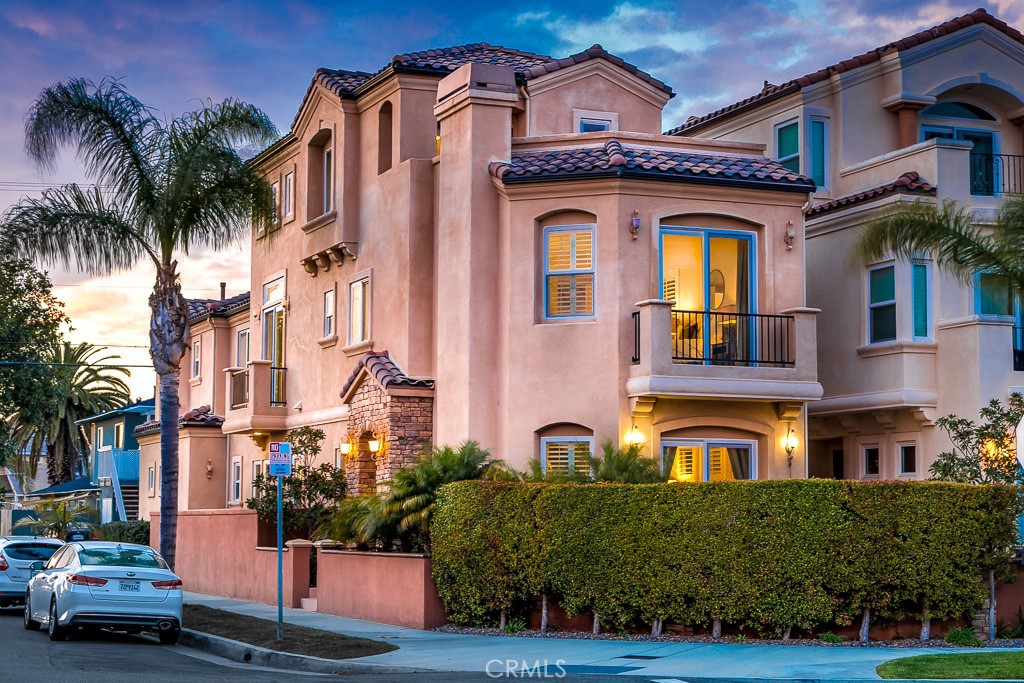 This thoughtfully custom designed beach home is where modern luxury meets coastal lifestyle with a touch of elegance and sophistication. Located on a highly coveted, premium corner lot, it’s just blocks away from Huntington’s world-famous beach. Beautiful Versailles pattern travertine flows throughout the open main floor, with a spacious formal dining room that leads to a gourmet chef’s kitchen, where you can dazzle guests with your culinary flair. If not, surely the granite countertops, custom cabinetry, and top-of-the-line stainless steel appliances will. A private master suite features a gas fireplace with seating area, step-out balcony, large walk-in closet, dual vanity sinks, frameless shower and separate deep soaking tub. Embrace the cool ocean breeze on the front patio with privacy landscaping or bask in the warmth of the sun on your sizable rooftop deck that provides stunning sunset views. Living near the ocean is everyone’s dream. Can you imagine waking to a spectacular sunrise, the scent of the salty sea air, and the endless opportunities for beach living?