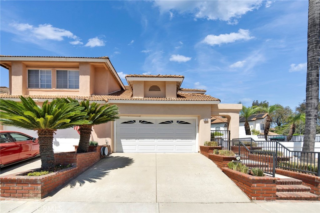 Welcome to 3072 Crape Myrtle, Chino Hills – A Beautifully Upgraded Two-Story Home in the Sought-After Village Oaks Community! Nestled at the end of a quiet cul-de-sac in one of Chino Hills’ most desirable neighborhoods, this beautifully maintained two-story home offers the perfect blend of privacy, comfort, and modern living. Located in the peaceful and friendly Village Oaks community, this residence sits on a large premium lot with no direct neighbors on either side or behind, offering exceptional privacy and unobstructed views from both levels. Step inside to discover a spacious and versatile layout featuring 3 large bedrooms and 3 full bathrooms. Ideal for multigenerational living or hosting guests, the home offers primary suites on the first floor, including a spacious master bedroom and a second bedroom with an adjacent full bath. The upper-level features one bedroom and a large loft with a full bathroom, which can be easily converted into a fourth bedroom. The heart of the home is the gourmet open-concept kitchen, beautifully updated with elegant quartz countertops, high-end custom cabinetry, contemporary lighting fixtures, and stylish finishes. Whether you're cooking for family or entertaining guests, the seamless flow from the kitchen to the dining and living areas creates the perfect gathering space. A bright and airy kitchen nook adds flexibility to the floorplan and can serve as a home office, study area, music room, reading nook, playroom, fitness space, or media center—tailor it to your lifestyle. Recent Upgrades & Features: • Brand-new luxury vinyl plank (LVP) flooring throughout the first floor (2025) • Fresh, neutral interior tones to suit any décor • New water heater (2024) • Solar panels for energy efficiency and reduced electricity costs • 2-car garage with ample storage space • No HOA fees, Mello-Roos taxes. Enjoy serene outdoor living in the custom brick courtyard at the side entry—ideal for morning coffee or evening gatherings. The spacious backyard features mature landscaping, a large lawn, and brick hardscape—perfect for barbecues, entertaining, or simply relaxing in your private oasis. Prime Location in the heart of Chino Hills, this home offers easy access to: • Top-rated schools • Shopping and dining at The Shoppes at Chino Hills • Beautiful local parks and trails • Major freeways (71, 91, 60) for convenient commuting. Don’t miss your chance to make this your forever home — schedule your private tour today!