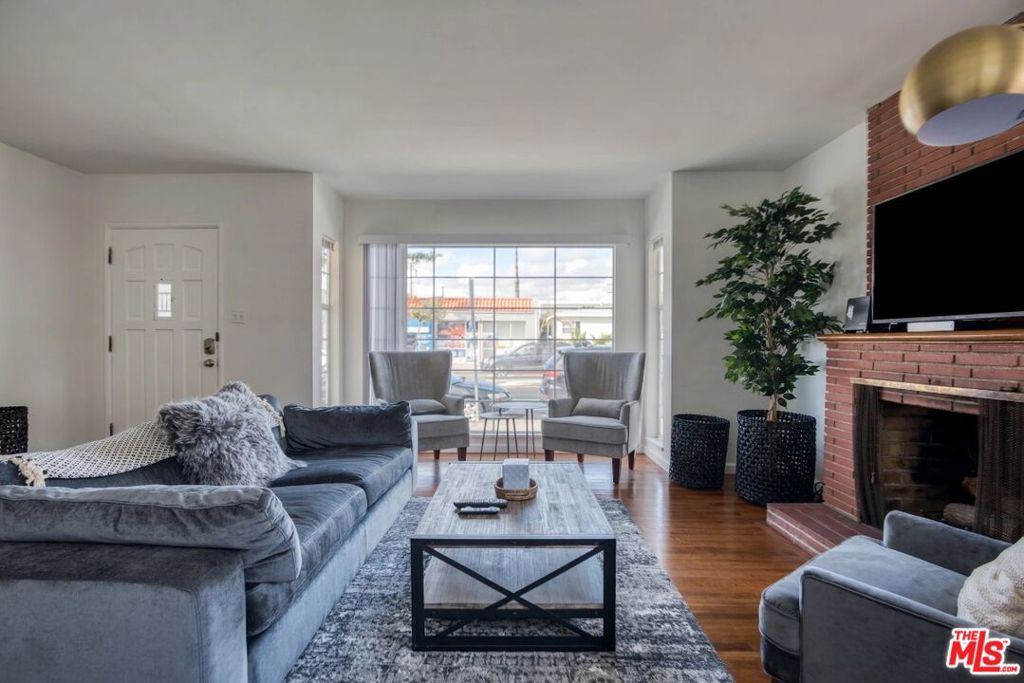 Welcome to 2310 Ocean Park Blvd, a beautifully updated and fully furnished 2-bedroom, 1-bath residence in the heart of Santa Monica's sought-after Sunset Park neighborhood. This bright and inviting home features hardwood floors, a spacious living room with fireplace, and a modern kitchen with stainless appliances. Enjoy the convenience of in-unit laundry, two off-street parking spaces, and a private gated lawn. Just minutes from the beach, local shops, dining, and top-rated schools, this property offers the perfect blend of comfort, style, and location.