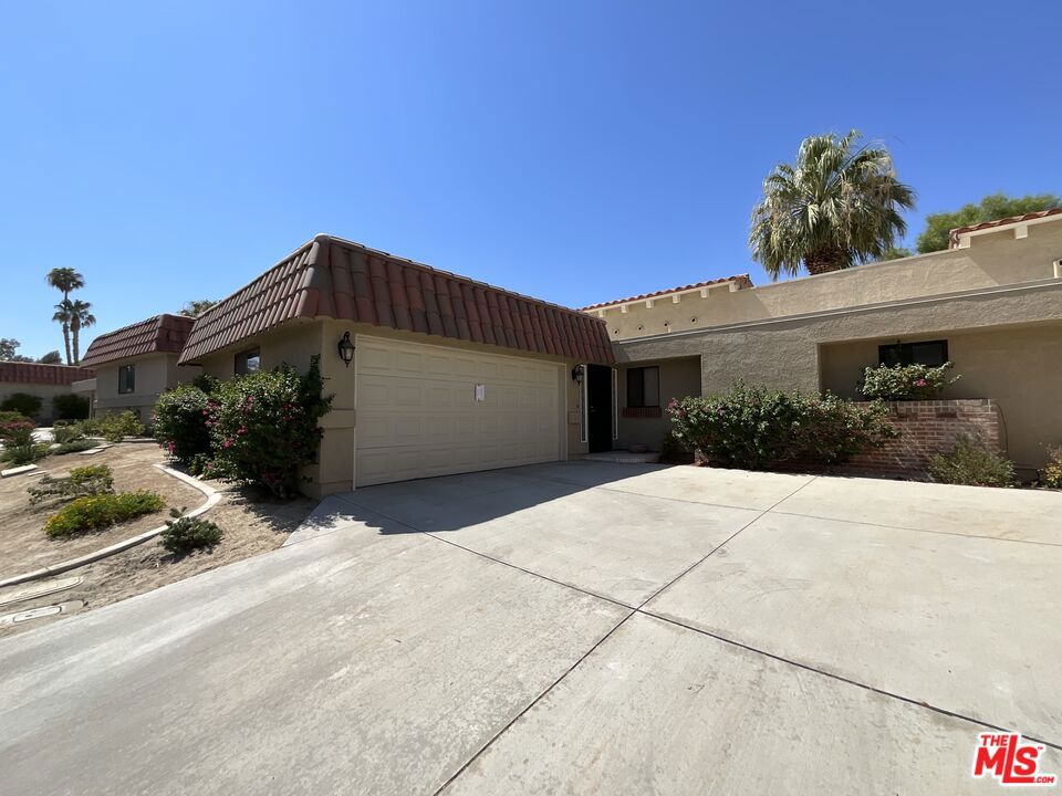 Live in one of the best country club's in the desert! This awesome 2 bed, 2 bath condo has gone through upgrades and you will love it here. The pool is STEPS from the back patio and the unit has all the appliances included. Bring your furniture and enjoy desert living. You can become a member at the tennis and pickle ball courts or book a tee time at the golf course. Don't delay!