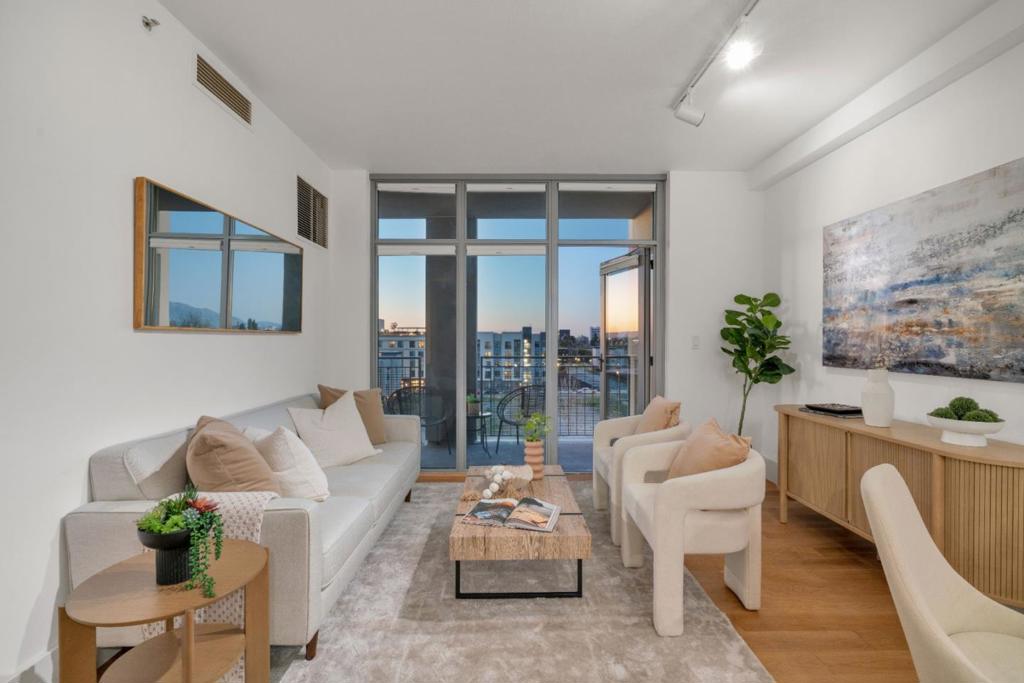 One-of-a-Kind Remodeled Condo in the Heart of Downtown San Jose! Completely reimagined and truly unique, this 1-bedroom, 1-bathroom condo at City Heights shines with designer-quality finishes. Remodeled in 2021 with over $80,000 in upgrades, this home offers modern elegance at every turn. The brand-new kitchen features sleek quartz countertops, marbled backsplash, custom cabinetry, and all-new stainless steel appliances. The bathroom boasts a walnut vanity, slate tile flooring, and honeycomb tile shower surround. No expense was spared, with wide-plank oak flooring, plush bedroom carpet, custom lighting, honeycomb shades, new baseboards, and fresh designer paint. A standout feature is the expansive balcony spanning the width of the home, offering outdoor space and a private storage closet. HOA covers water, garbage, high-speed internet, and luxury amenities including a gym, conference room, mailroom, stylish lobby, and onsite management. Deeded garage parking adds convenience. Located steps from San Pedro Square, Pellier Park, restaurants, shops, and entertainment, with easy access to Highways 280, 101, 87, SJC, Caltrain, this home offers the perfect blend of luxury, convenience, and vibrant city living. Don't miss this rare opportunity to own a beautifully upgraded condo!