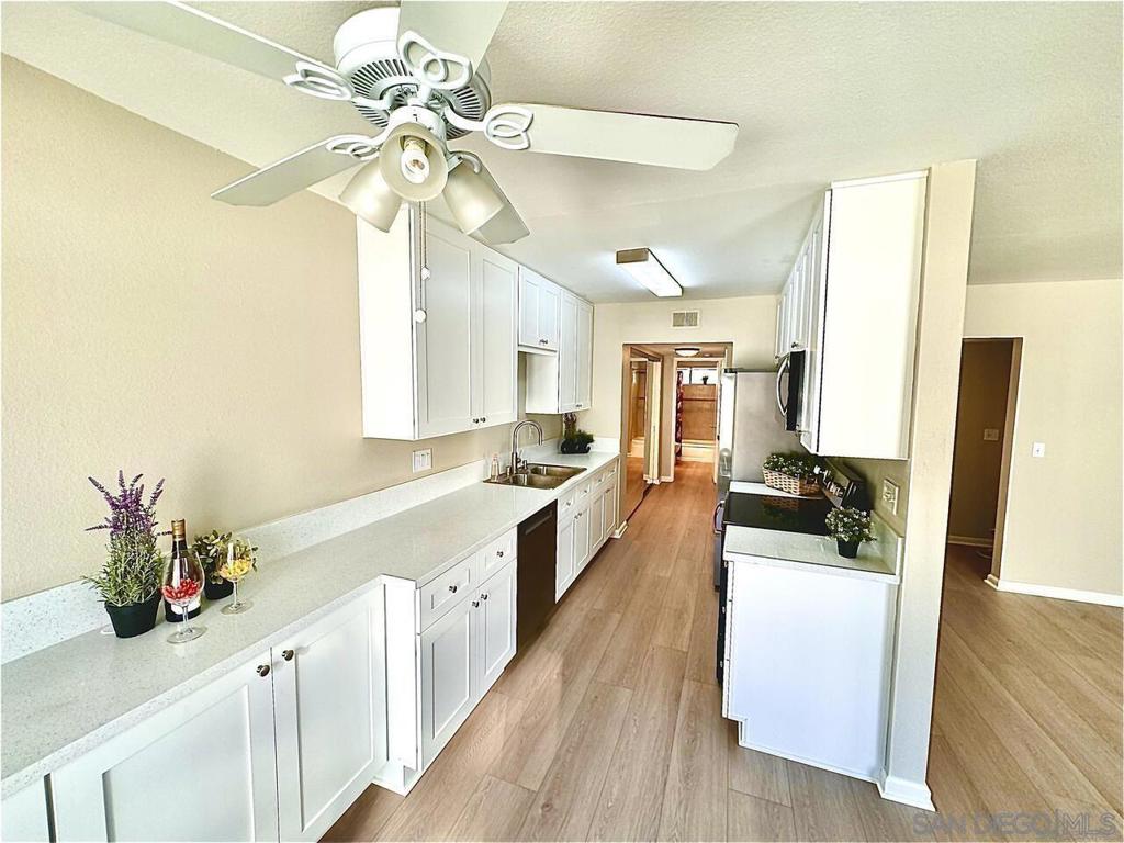 Fully updated condo with new kitchen, flooring, bathroom, mirrored wardrobe doors and blackout blinds in this upstairs unit. Fireplace in living room. Large balcony with laundry closet and full size washer and dryer. Quiet complex has pool, spa, tennis, pickleball and covered parking. Walking distance to stores and restaurants. Couple minutes to freeways. Abundant guest parking just outside your new home. HOA pays for water, gas, sewer and trash.