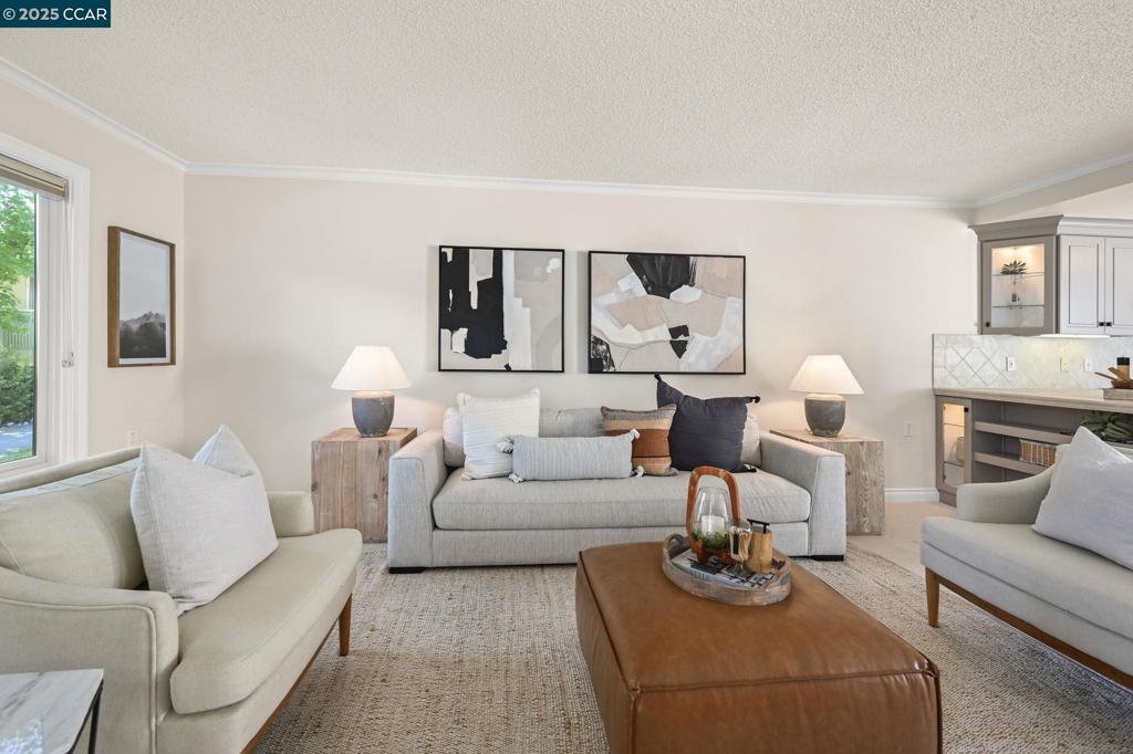 Welcome to this beautifully updated single-row Golden Gate model—a bright and inviting 2-bedroom, 1-bath home that perfectly blends comfort, sophistication, and privacy. From the moment you step inside, natural light pours through dual-pane windows and a sliding glass door, creating a warm and airy ambiance. The thoughtfully updated interior features new carpeting, elegant crown molding, and a modern kitchen complete with stainless steel appliances and abundant cabinetry. Ideal for both relaxing evenings and casual entertaining, the open layout offers seamless flow and practical functionality. A spacious walk-in Jacuzzi tub adds an extra touch of luxury, while an in-unit washer and dryer provide everyday convenience. Step outside to your own secluded, private patio—easily accessible from the exterior—offering the perfect retreat for outdoor enjoyment. Additional highlights include generous interior storage, a dedicated carport, and an exterior storage room for your extras. Best of all, this is a level-in home, offering easy accessibility and truly move-in ready comfort.