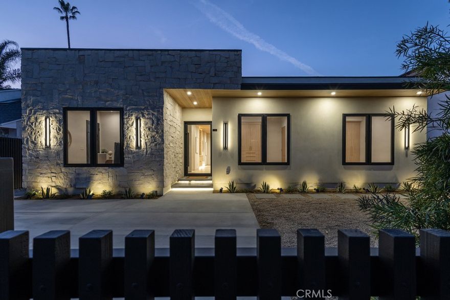 Behind a private gate, this exquisitely rebuilt and fully remodeled residence delivers a rare blend of sophisticated design, modern innovation, and resort-style living. Thoughtfully curated throughout, the home offers 4 bedrooms and 3.5 bathrooms, to include a beautifully integrated ADU or flexible bonus space ideal for a guest suite, executive office, or private media lounge.

At the heart of the home, the designer chef’s kitchen is a statement of both form and function, featuring top-tier appliances including a professional-grade range, premium refrigerator, wine refrigerator, ice maker, and built-in microwave. Custom cabinetry, a generous pantry, and abundant storage complete this exceptional culinary space.

The primary suite is a serene sanctuary, highlighted by a spa-caliber bathroom with a dramatic skylit shower and an expansive, custom-designed walk-in closet offering exceptional organization and storage. Additional skylights throughout the residence bathe the interiors in natural light, accentuating the home’s clean lines and contemporary architectural elegance.

Smart-home technology enhances everyday living with Lutron programmable lighting and switches controlled via smartphone, pre-wired audio and TV connections, and thoughtfully layered ambient and architectural lighting throughout.

Designed for effortless indoor-outdoor living, the private backyard retreat features a newly constructed saltwater pool and jacuzzi—perfect for refined entertaining or tranquil relaxation. Fully gated for ultimate privacy and security, the property is ideally positioned on a quiet residential street in sought-after Tarzana, just minutes from Ventura Boulevard’s premier shopping and dining, scenic parks and hiking trails, prestigious country clubs, and convenient freeway access.