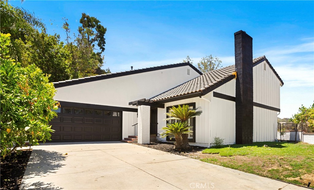 Set high in the hills of Whittier’s coveted Spy Glass community, this beautifully remodeled two story home brings together clean design, quality finishes, and a layout that just feels right. With 4 bedrooms, 3 bathrooms, including one bed and full bath downstairs, it offers flexibility for guests, office space, or multi generational living.
The main level is completely open, with the kitchen, dining area, living room, and family room all flowing together. It’s the kind of layout that makes everyday life feel easy and hosting feel effortless. The kitchen features quartz countertops, custom cabinetry, and stainless appliances.
Upstairs, the primary suite gives you a real sense of retreat. You’ve got a walk-in closet and a private deck with hillside views that stretch out in the distance. The bathroom includes dual sinks, a dedicated vanity, and updated finishes that feel clean and calming.
Tucked at the end of a quiet cul-de-sac, this home offers both privacy and a strong sense of community. Come view this home before it’s too late!