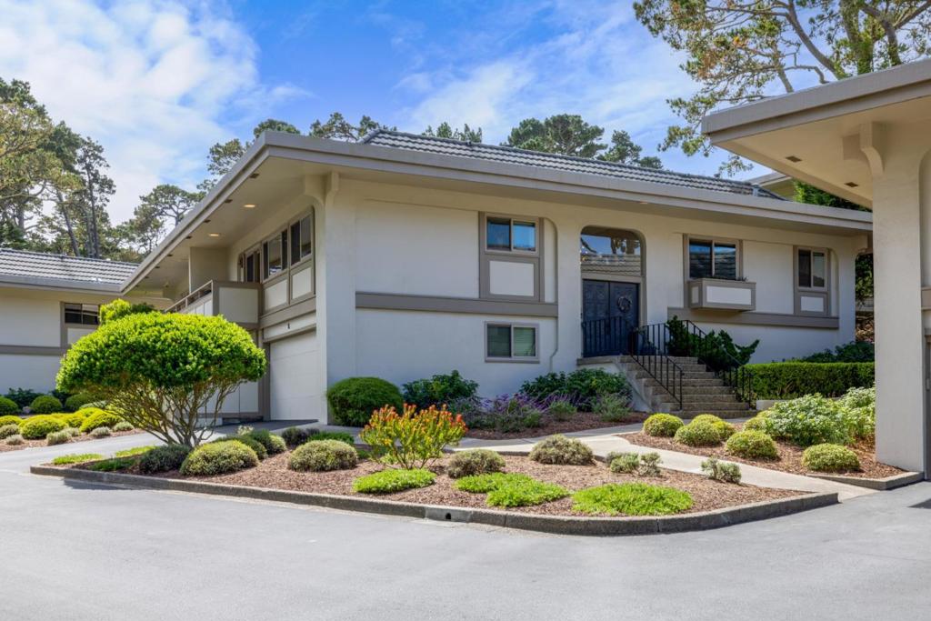 Welcome to your dream home in the heart of Skyline Crest, Monterey - where luxury meets comfort in a beautifully updated 3-bedroom, 3-bath retreat. Step into an open-concept kitchen designed to impress, featuring sleek quartz countertops, a stunning waterfall island, stainless steel appliances, and a charming farmhouse sink. The spacious living room invites you to unwind beside the cozy linear gas fireplace with fan heating while taking in peaceful forest views through large windows that bathe the home in natural light. The generous primary suite offers a private escape with double sinks and radiant-heated shower floors for a spa-like experience. Each bedroom includes its own updated en-suite bathroom, combining privacy with elegance for family and guests alike. This home also features a two-car attached garage, is wired for an electric car, and completed with thoughtful upgrades throughout - from the tiled patio and deck flooring to a large laundry-utility room with ample storage. Whether you are entertaining, relaxing, or adventuring, you're just minutes from beaches, scenic hikes, local restaurants, and the community pool. It's more than a home, it's the Monterey Peninsula lifestyle, elevated!