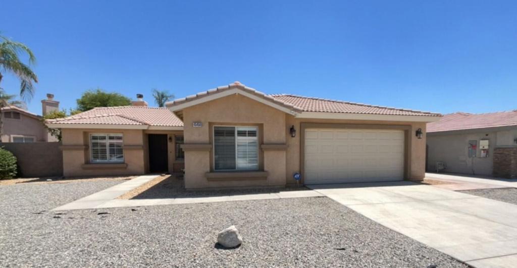North La Quinta Home with Pool / Spa. Hardwood floor throughout, carpet in bedrooms, ceiling fans throughout, fireplace, indoor laundry, kitchen has quartz countertops, large covered back patio with built in lighting, double car garage, owner provide pool maintenance.