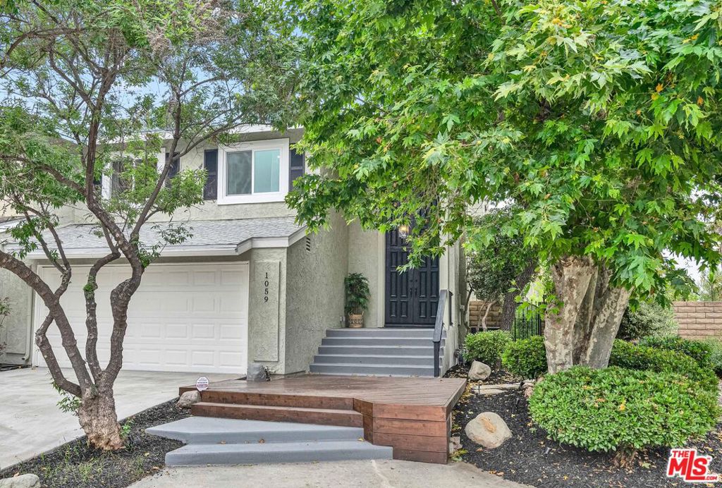 Welcome to this beautifully upgraded 3 bedroom, 3 bath home tucked away on a peaceful cul- de-sac in the scenic hills of western Simi Valley. Step through the elegant double doors into a warm, light-filled living room with soaring vaulted ceilings, new flooring, and a cozy fireplace. A large sliding glass door opens to a serene backyard retreat, creating the perfect indoor-outdoor flow. The formal dining area connects seamlessly to the updated kitchen, a true chefs delight, featuring brand-new white shaker cabinets, sleek quartz countertops, and stainless steel appliances, ideal for cooking, hosting, or everyday living. Upstairs, the spacious primary suite offers a private balcony with peaceful hillside views. The spa-inspired en-suite bath features dual sinks and a deep soaking tub, your personal escape at the end of a long day. The backyard is an entertainers dream, with a charming pergola, mature fruit trees, and a spacious patio, perfect for morning coffee or evening wine. All located near parks, hiking and biking trails, top- rated schools, shopping, dining, and easy freeway access, this home offers comfort, style, and the best of Simi Valley living.