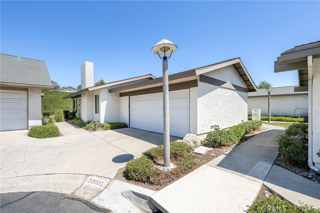 Welcome home to 20001 Wildwood Ct in the Woodgate Community of Yorba Linda. This is a completely detached 2 bedroom, 1 bathroom home with an attached garage! Truly a sought after and rare find! Upon entering the property, you’re greeted by the living room with vaulted ceilings. Beyond the living room, is the spacious kitchen and dining nook, which lead to the private outdoor patio and access to the community’s expansive green belt. Back in the home, you’ll find 2 bedrooms and 1 bathroom. One bedroom has direct access to the bathroom, which can also be accessed from the hallway. The bathroom features a large vanity with generous counterspace and beautiful white tiled walk-in shower. If you are not familiar with the Woodgate community, it is truly one of the Yorba Linda area’s best values; 234 fully detached condo-homes across 22 private cul-de-sacs, community clubhouse, pool & kiddie pool. Adjacent Woodgate Park includes tennis, racquetball/handball, basketball & expansive grassy field, paid by the county helping to keep HOA dues lower. Ultra-convenient to the 91/55 freeways, Toll Road, Yorba Regional Park, as well as great shopping at Savi Ranch & the New Yorba Linda Town Center! Woodgate also feeds into some of the very best schools in Pla-Yorba Linda USD including sought-after Glenknoll Elementary & the new Orange County School of Computer Science at Bernardo Yorba! Woodgate is a condominium community, yet each detached home feels very much like your own single-family home! 20001 Wildwood Ct; You will LOVE living here!