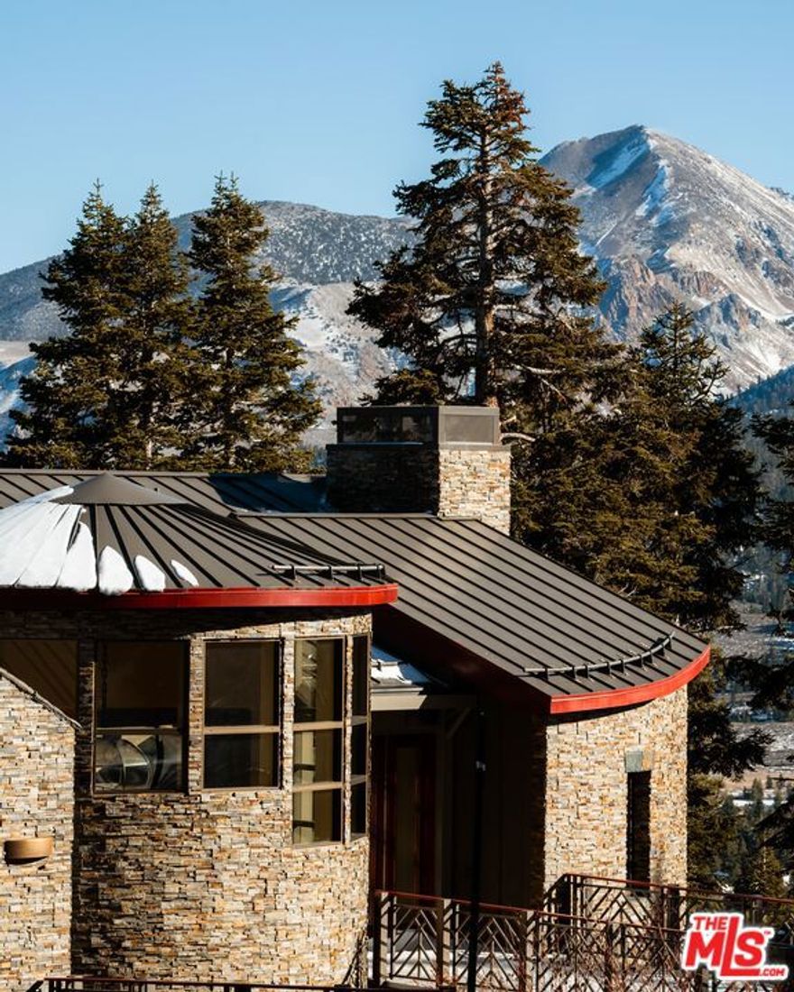 Step into a rare opportunity to own a home in Mammoth's most sought-after neighborhood, where properties seldom come to market. Nestled in the exclusive mountainside enclave of Greyhawk, this remarkable residence offers unmatched privacy, tranquility, and direct ski-in/ski-out access just steps from the slopes above Mammoth Mountain's Eagle Lodge. Designed by the esteemed architect Richard Landry, the home seamlessly blends timeless elegance with impeccable craftsmanship, featuring only the finest materials. Every detail has been meticulously curated, from the heated mahogany floors and ambient mood lighting to soaring ceilings and expansive windows framing breathtaking mountain views in every room. The gourmet kitchen, equipped with top-of-the-line Sub-Zero and Wolf appliances, a spacious pantry, and wet bar, are perfect for entertaining. Outside, three generously sized decks and a covered spa provide sweeping mountain vistas, golden sunrises, and captivating sunsets, effortlessly uniting indoor and outdoor living. Practicality and sophistication are intertwined, with a four-car garage complete with a workshop, abundant storage, and thoughtfully designed spaces that enhance both form and function. More than just a home, this is a sanctuary, a masterpiece of design destined to become a cherished legacy for generations.  Experience the grandeur and unparalleled beauty of this extraordinary property in person to truly appreciate its charm and significance.