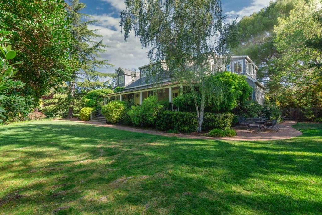 Total of 5,189 sf: +/-4,129 sf in Main House and +/-1,060 sf in Guest House. We are pleased to present this beautiful estate, which is located in close proximity to downtown Los Altos on a flat +/-1.15 acre parcel. The property includes a total of 5 bedrooms, plus an additional library and study. The detached guest house includes 2 of the bedrooms, a full kitchen, a large living room and an oversized 2 car garage. The home, grounds and setting around the tennis court feel as though this property has been transported from the East Coast. Located on a court, within the Palo Alto Unified School District and only a short distance from Pinewood School (Private) and Esther Clark Park. When navigating the 3D tour, the Highlight Reel at bottom displays the Guest House and select yard areas through 360 views. To return to the main house tour, select Explore 3D Space/Man Walking Icon in bottom Left of Highlight Reel. Highlight Reel may be collapsed by selecting down arrow.