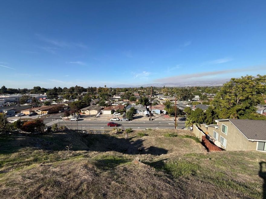 Build your dream home! This hillside residential lot in the heart of San Jose offers panoramic views, neighbors already in place, and two flat areas ideal for a tri-level home design. Based on city guidelines, a home up to 2,500 sqft may be possible. Utilities at the street. Buyer to verify all details. Bring your vision to life!