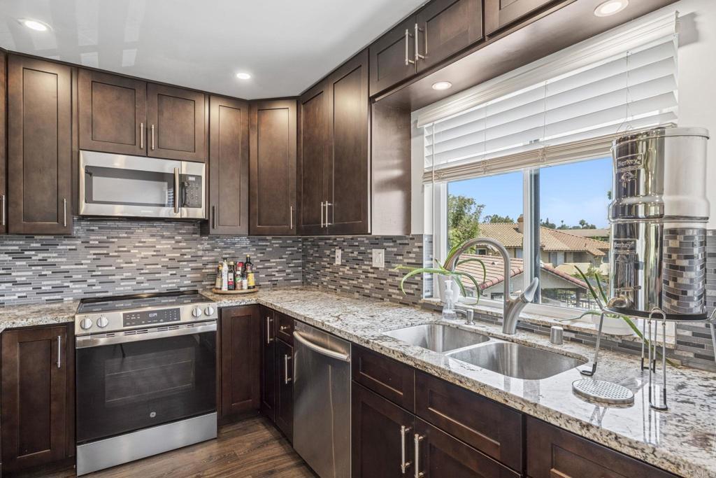 We previously dropped 10K and just added another 5K drop to help you land this great townhome! Welcome to 955 Postal Way – one of the best values in Vista - most affordable townhome right now! This beautifully remodeled 2-bedroom, 1.5-bath townhome is located in the gated Buena Vista Townhomes community and offers 972 sq. ft. of updated, move-in ready living. With recent improvements throughout, including modern countertops, fresh cabinetry, updated flooring, and interior paint, this home blends comfort and style with affordability. Light & Bright Living: The open-concept layout is filled with natural light, creating an inviting space for both relaxing and entertaining. Enjoy your private front patio—perfect for morning coffee, outdoor dining, or weekend BBQs. Gated Community with Perks: Comes with two assigned parking spaces and access to a sparkling pool and well-kept green spaces—everything you need for easy, low-maintenance living. Central Location: Just minutes to shopping, dining, schools, parks, and major freeways—convenience is at your doorstep. Don't miss your opportunity to own a fully upgraded townhome in a prime Vista location—now with a $10,000 price improvement! Schedule your showing today.